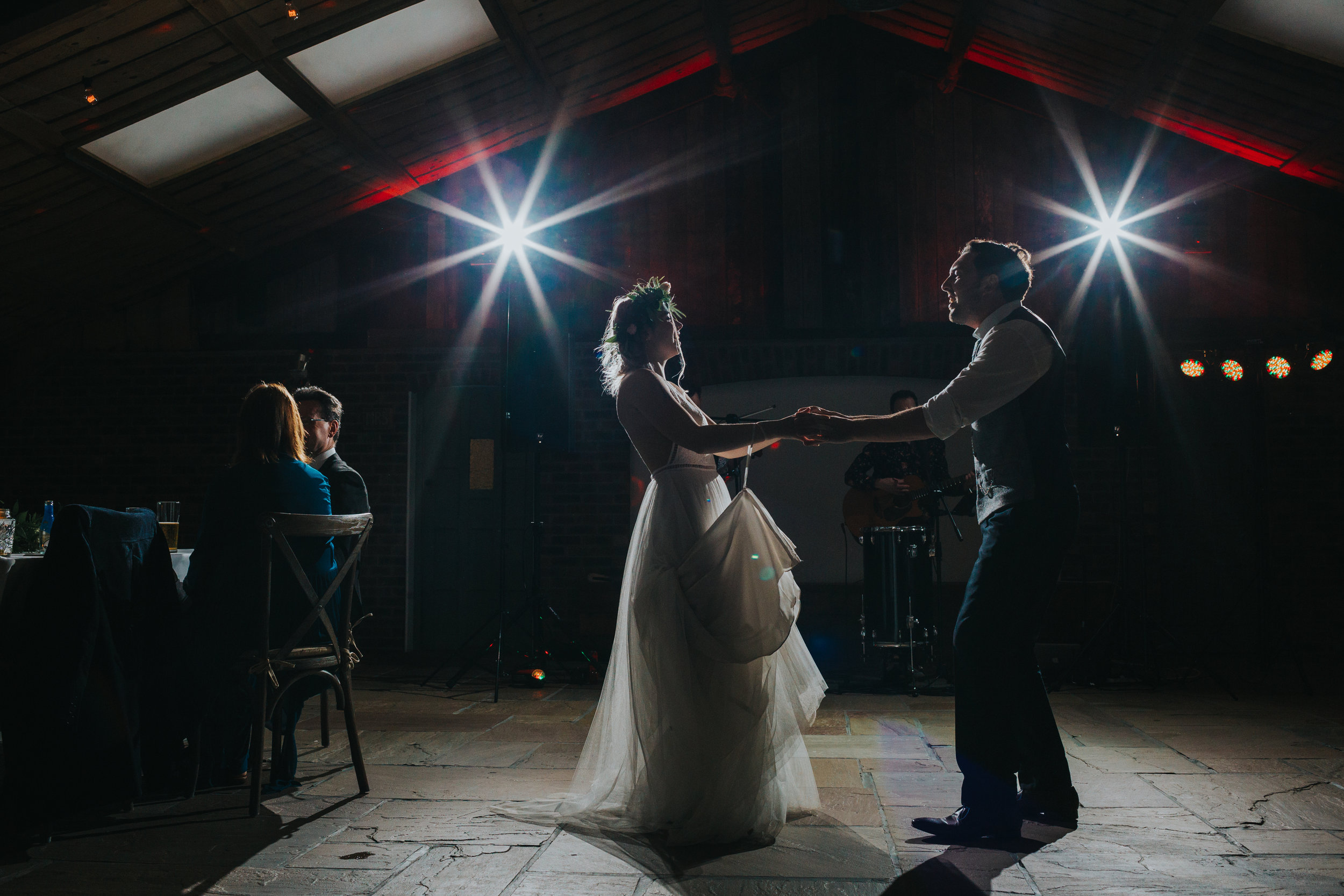 Bide and groom dance together at Owen House Wedding Barn. 