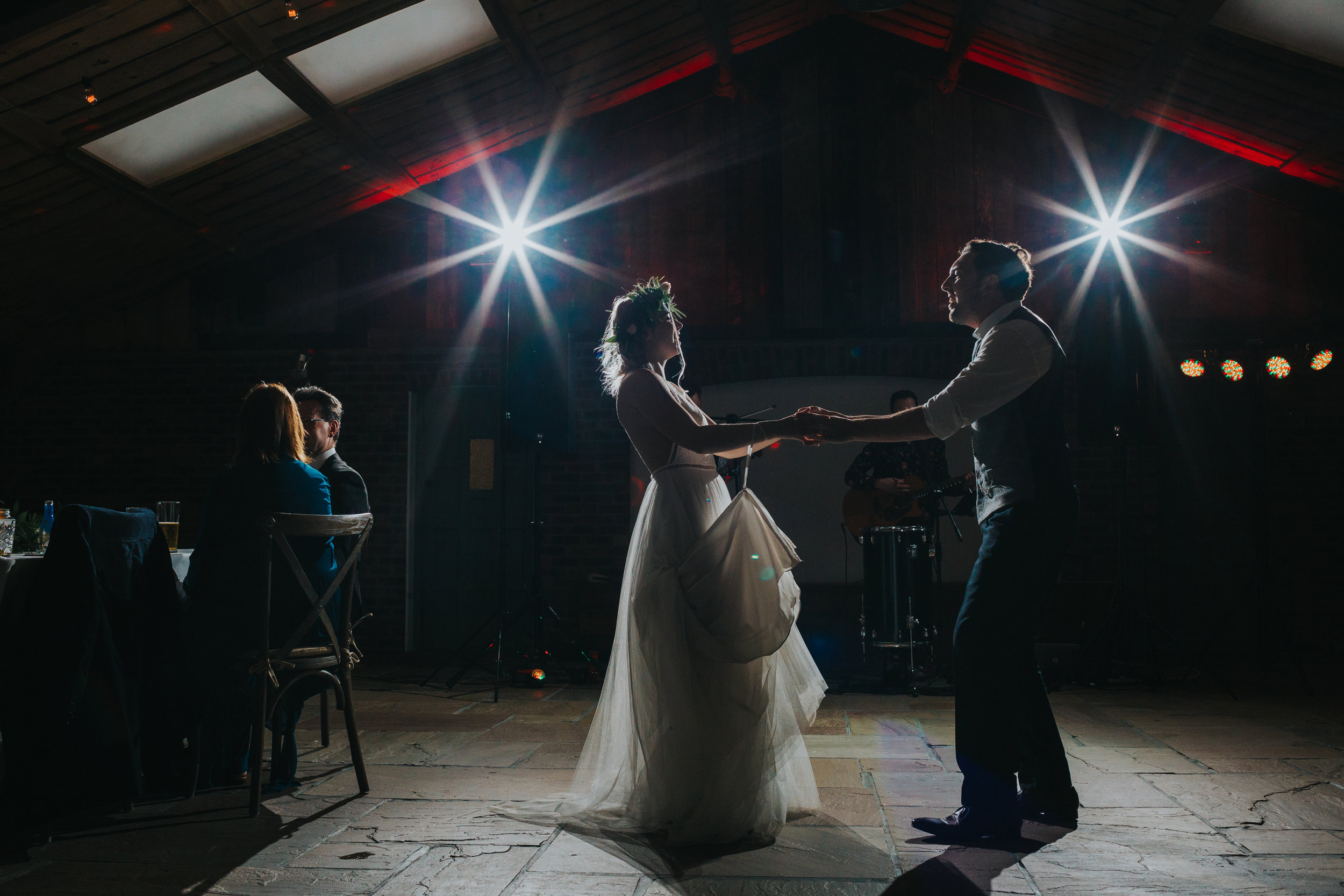 Bide and groom dance together at Owen House Wedding Barn.
