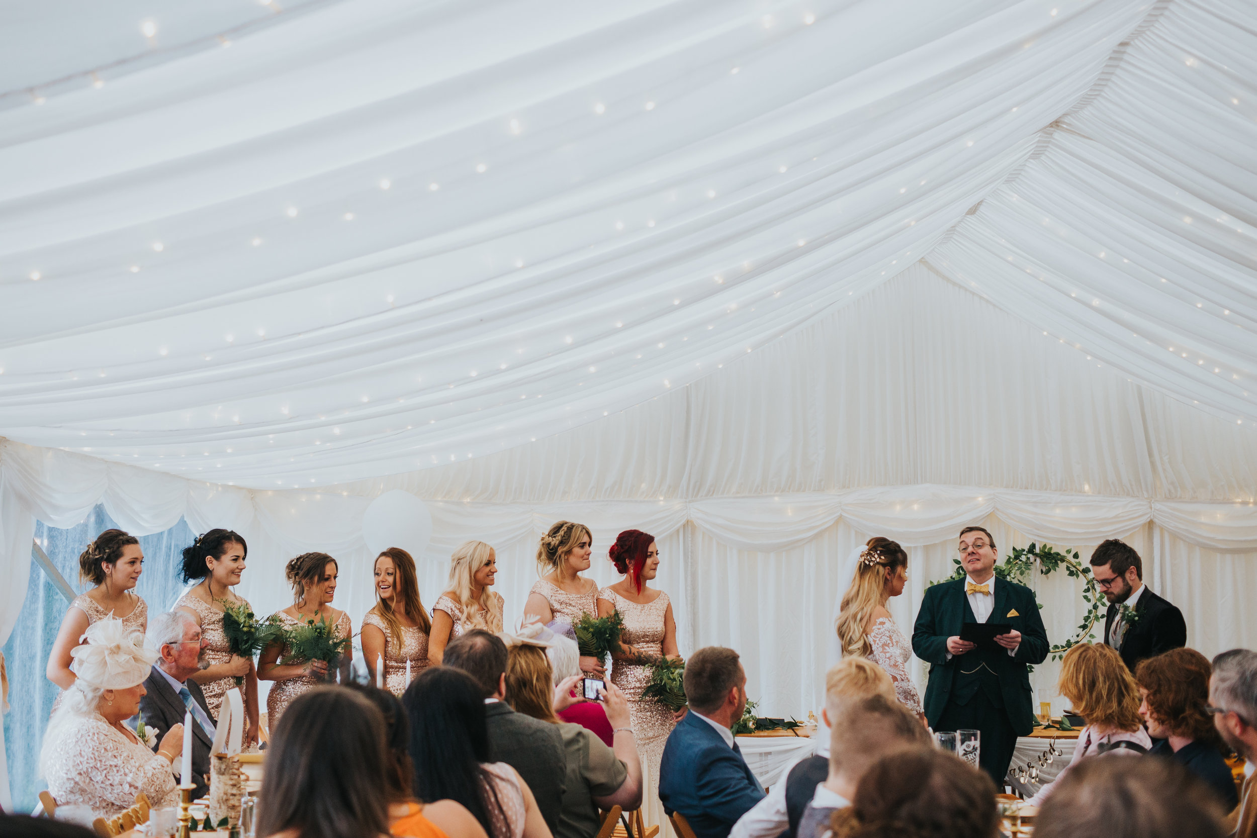 Bridesmaids give a reading as the Bride and Groom stand together. 