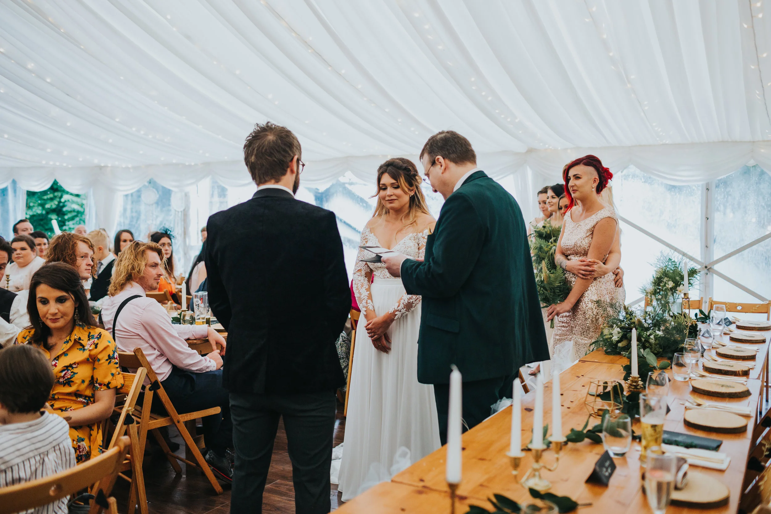 The bride and groom say their vows. 