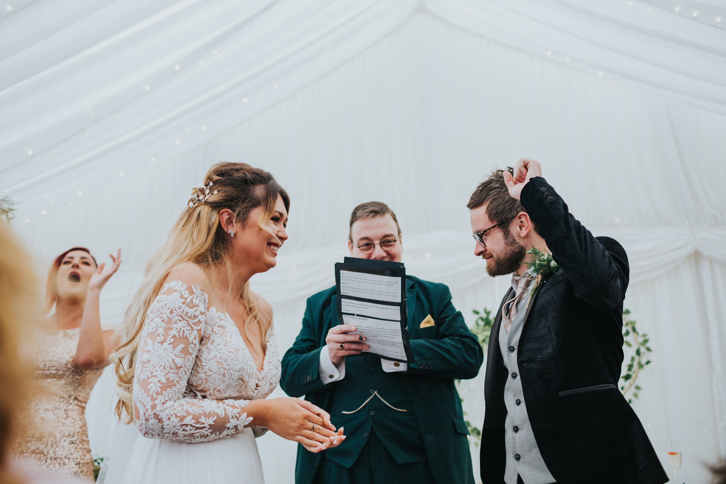 Bride and groom cheer as they are finally married! 