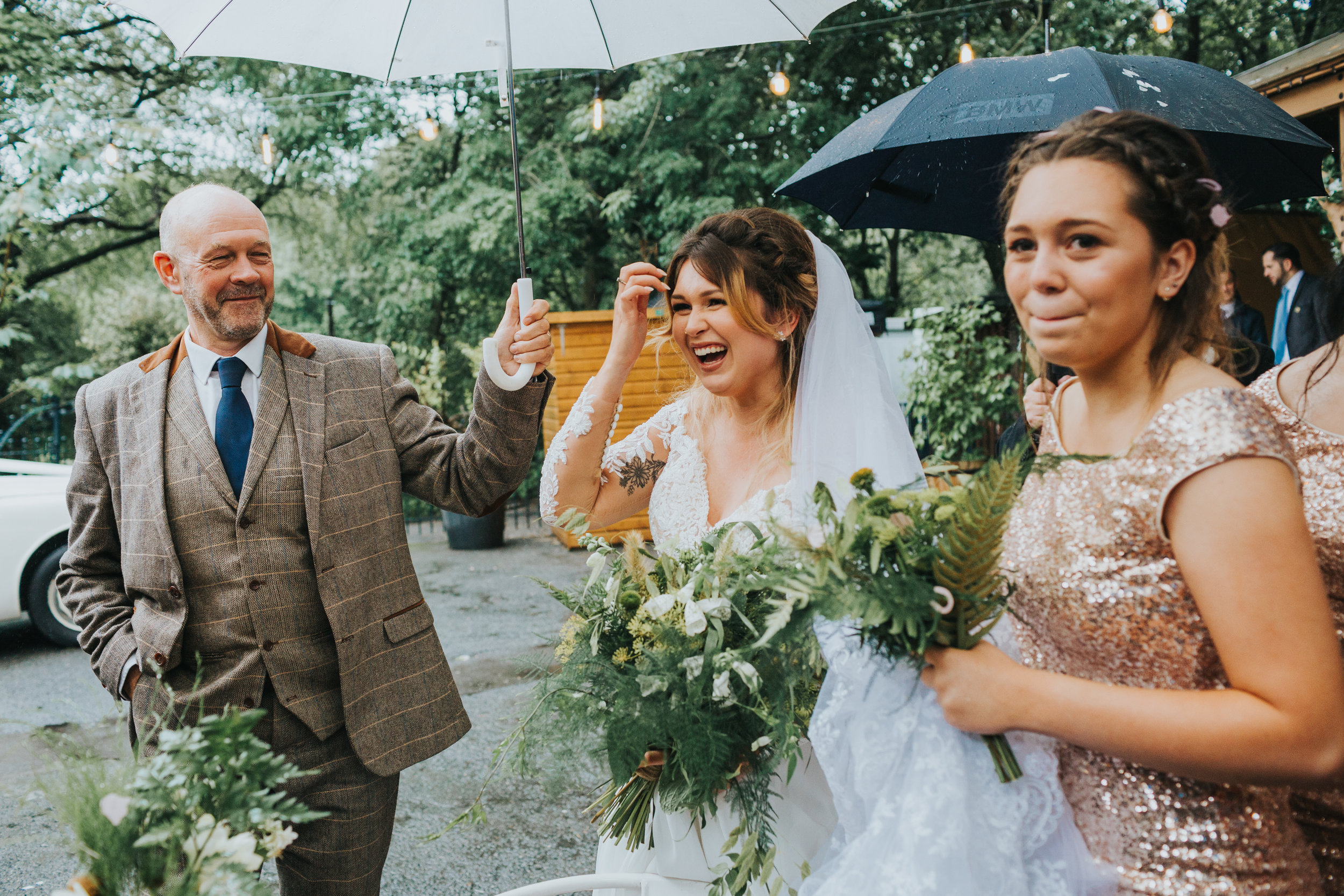 Bride laughs with wedding guests. 