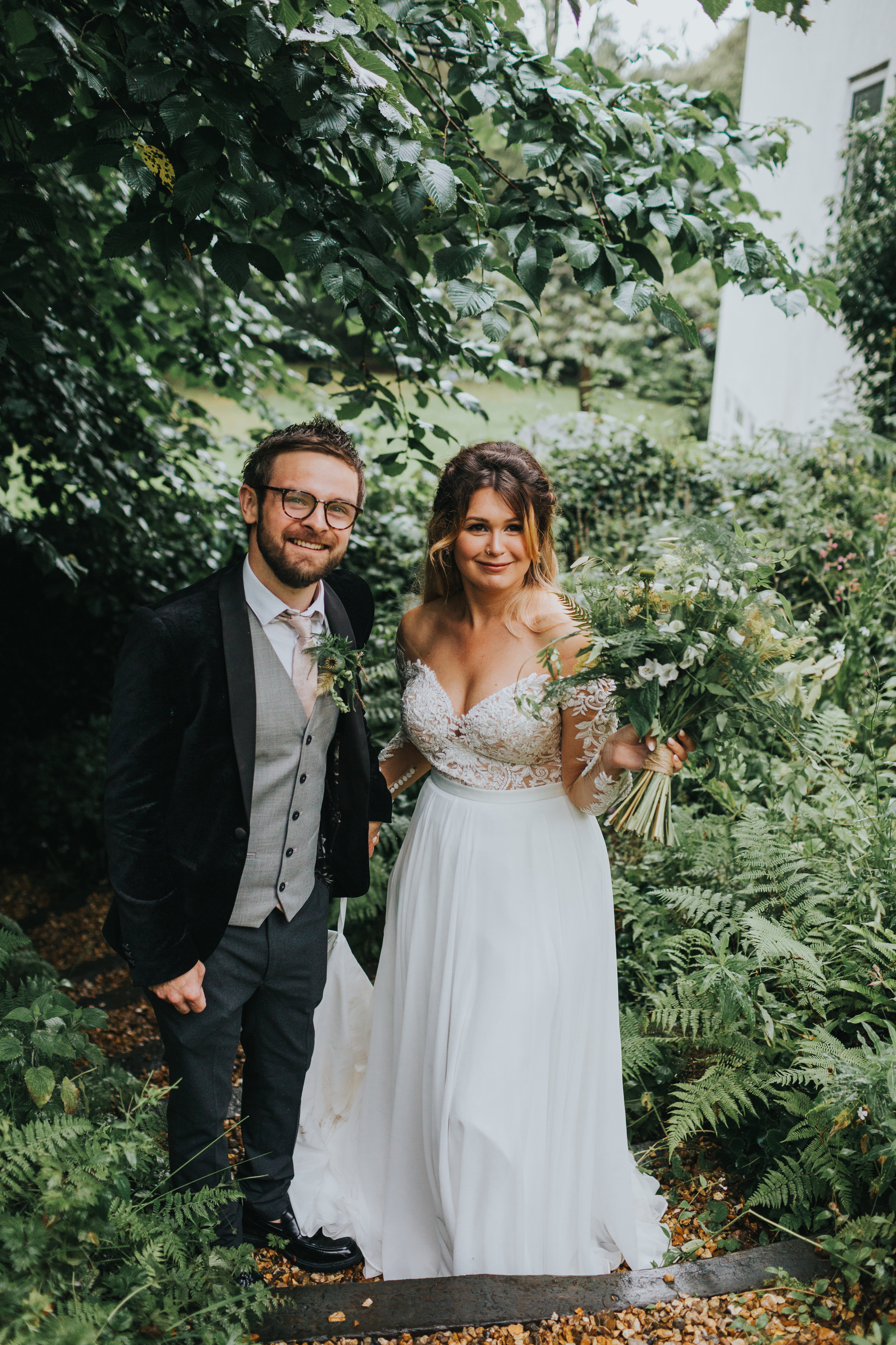 Bride and groom pose for photo. 