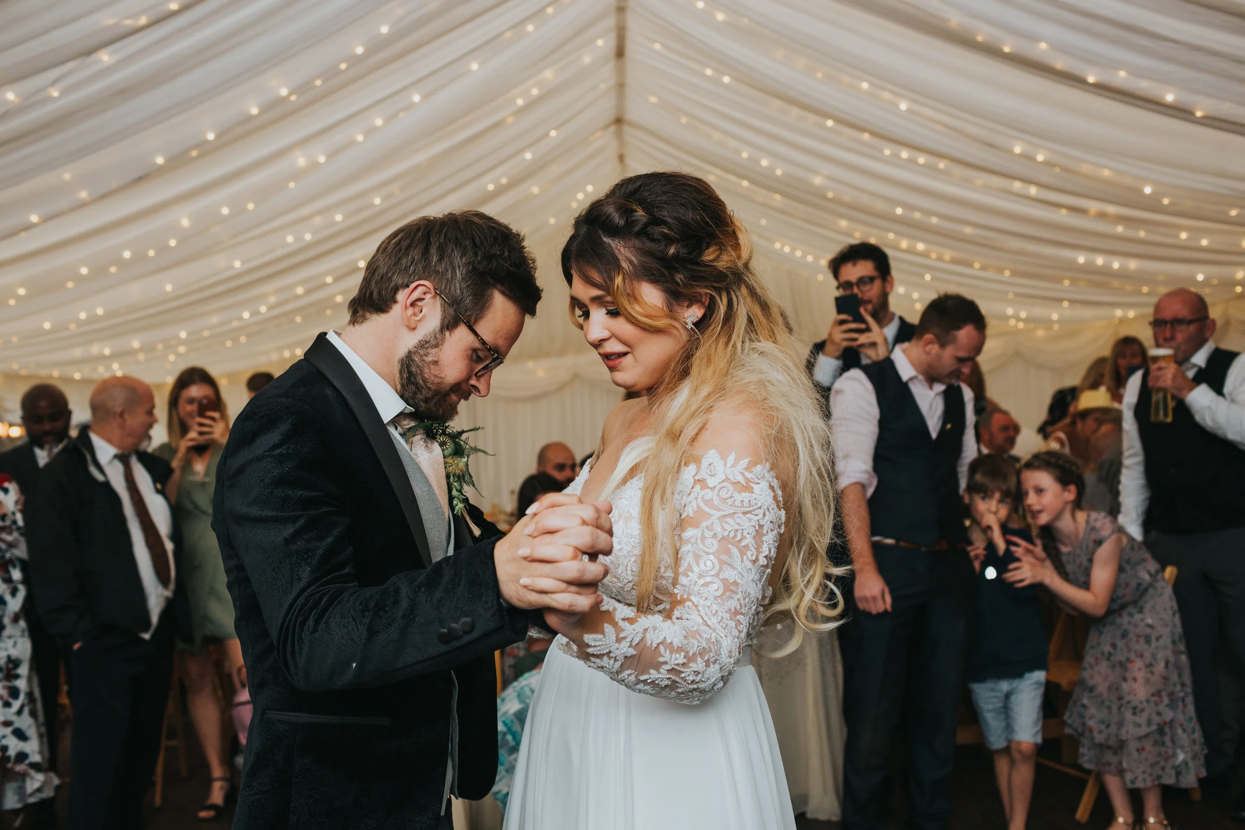 The couple have their first dance. 