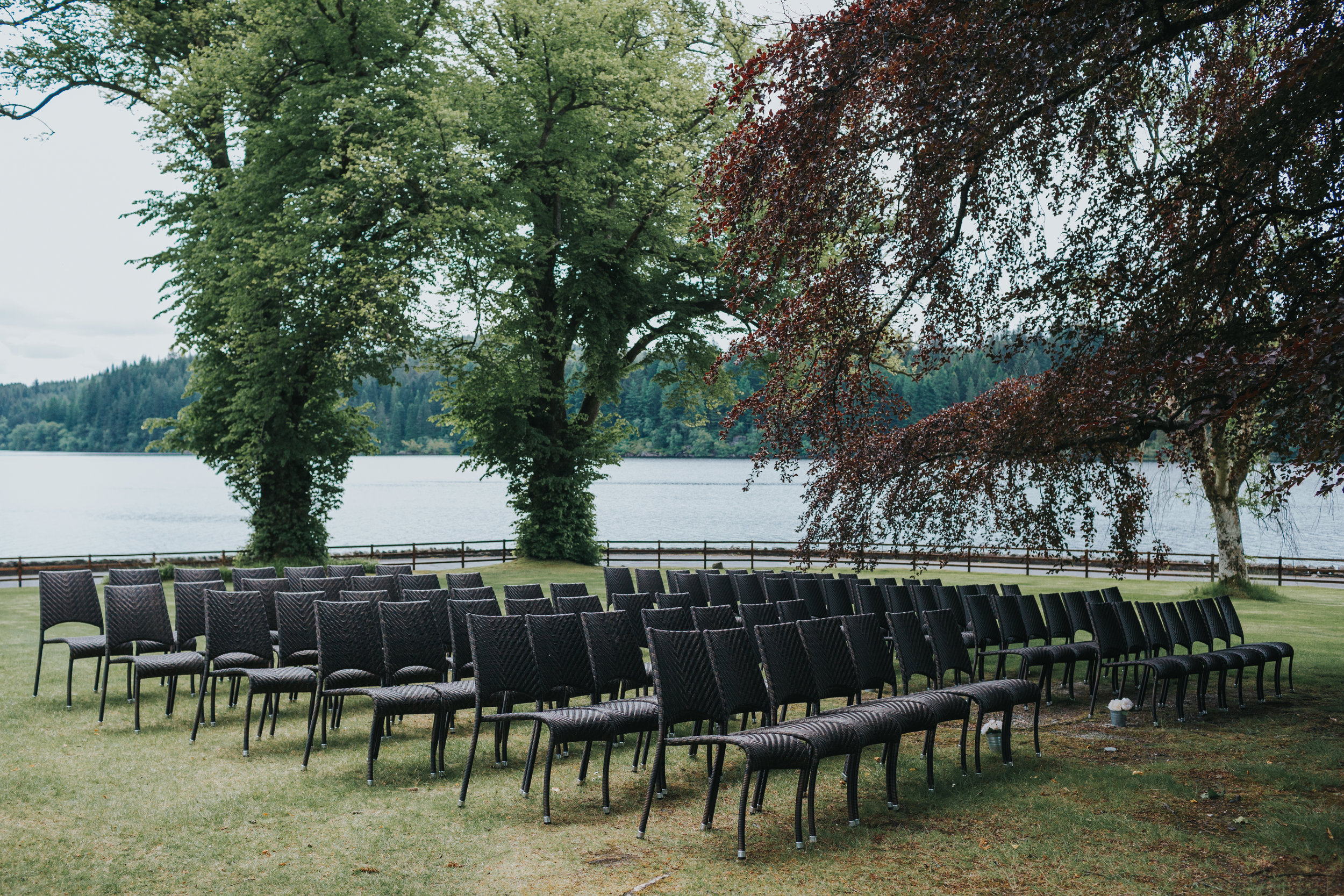 Chairs await wedding guests bottoms under The Beech Tree. 