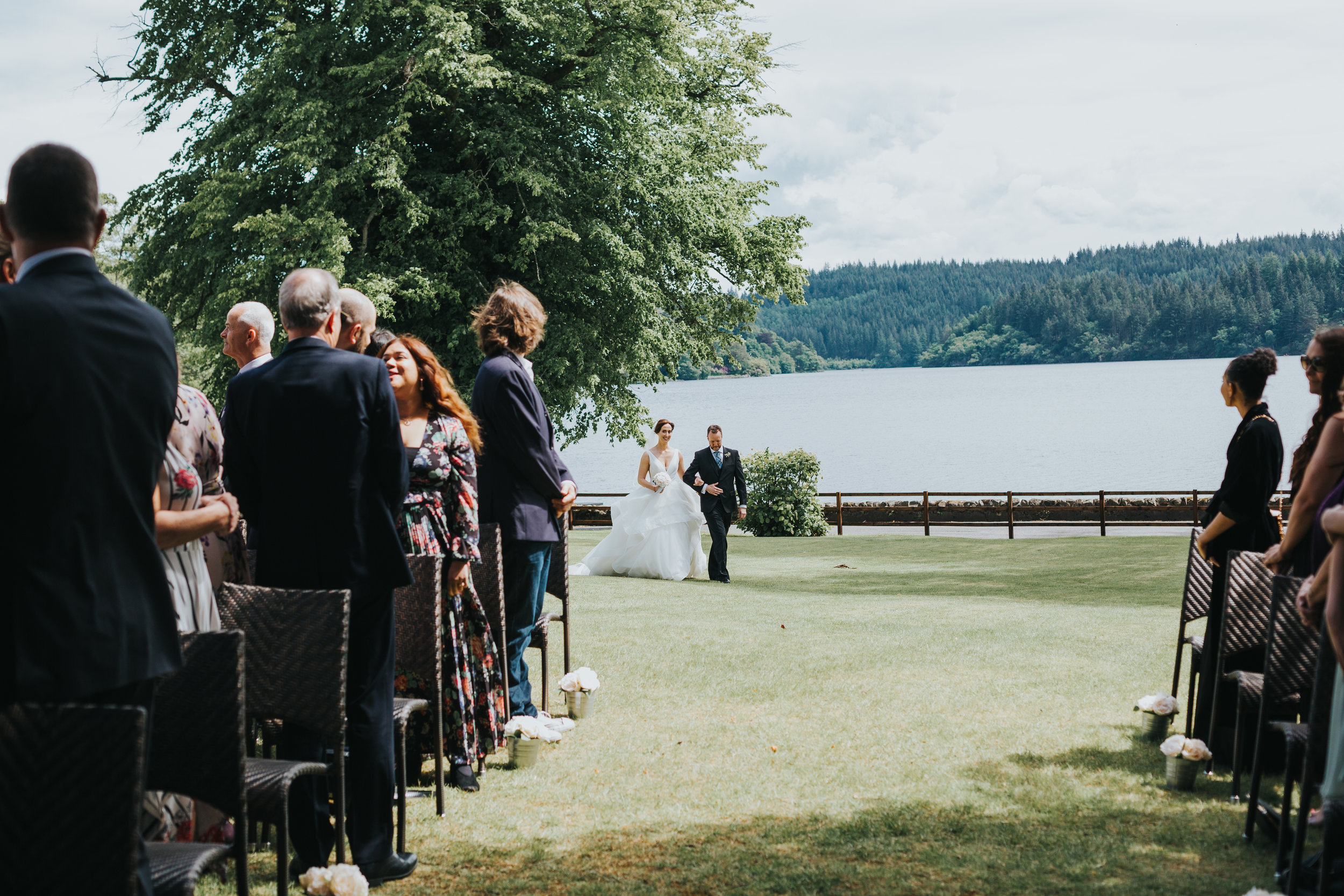 Bride and her brother appear in the distance.