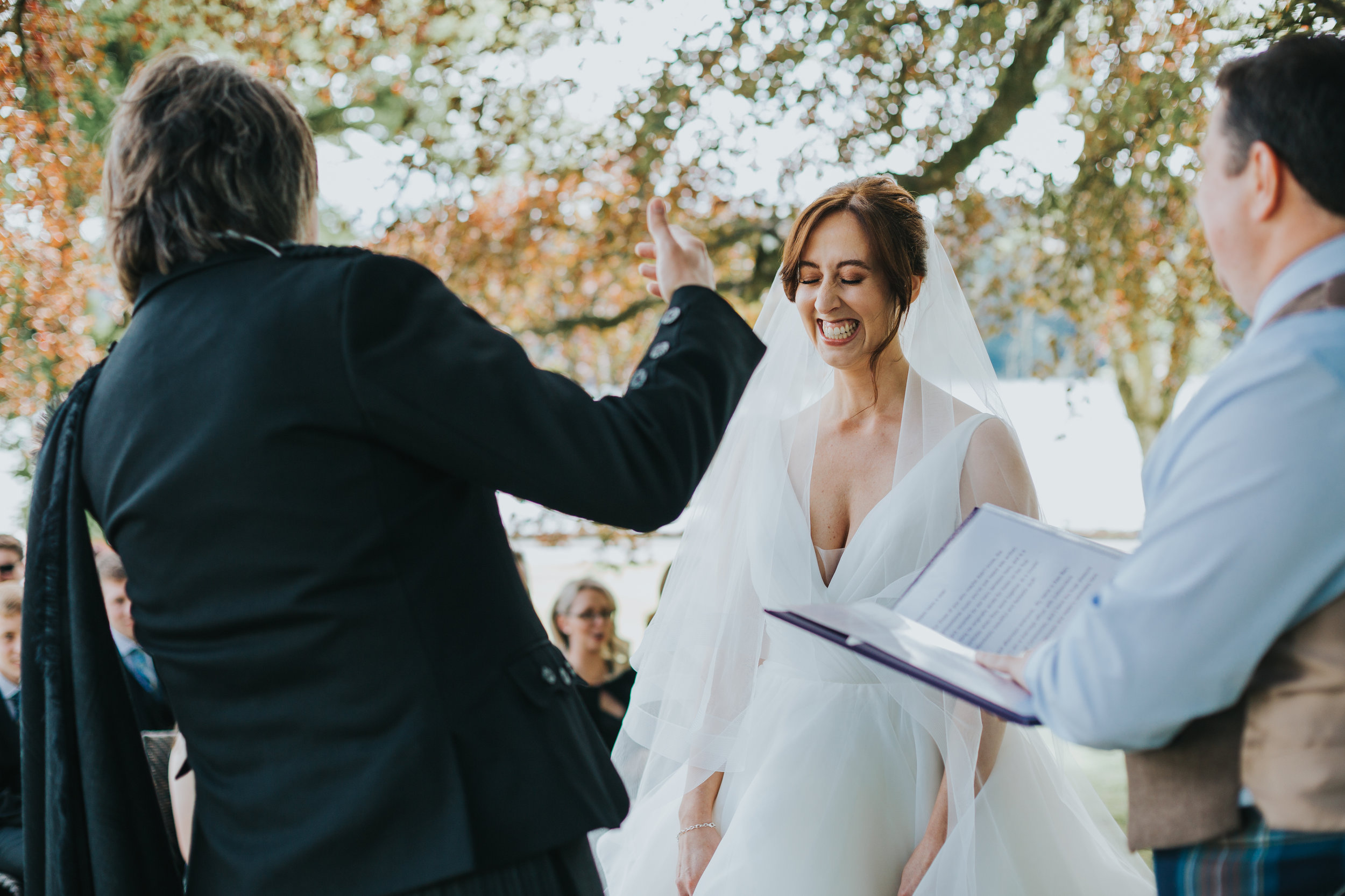 Bride looks beautiful as she laughs.