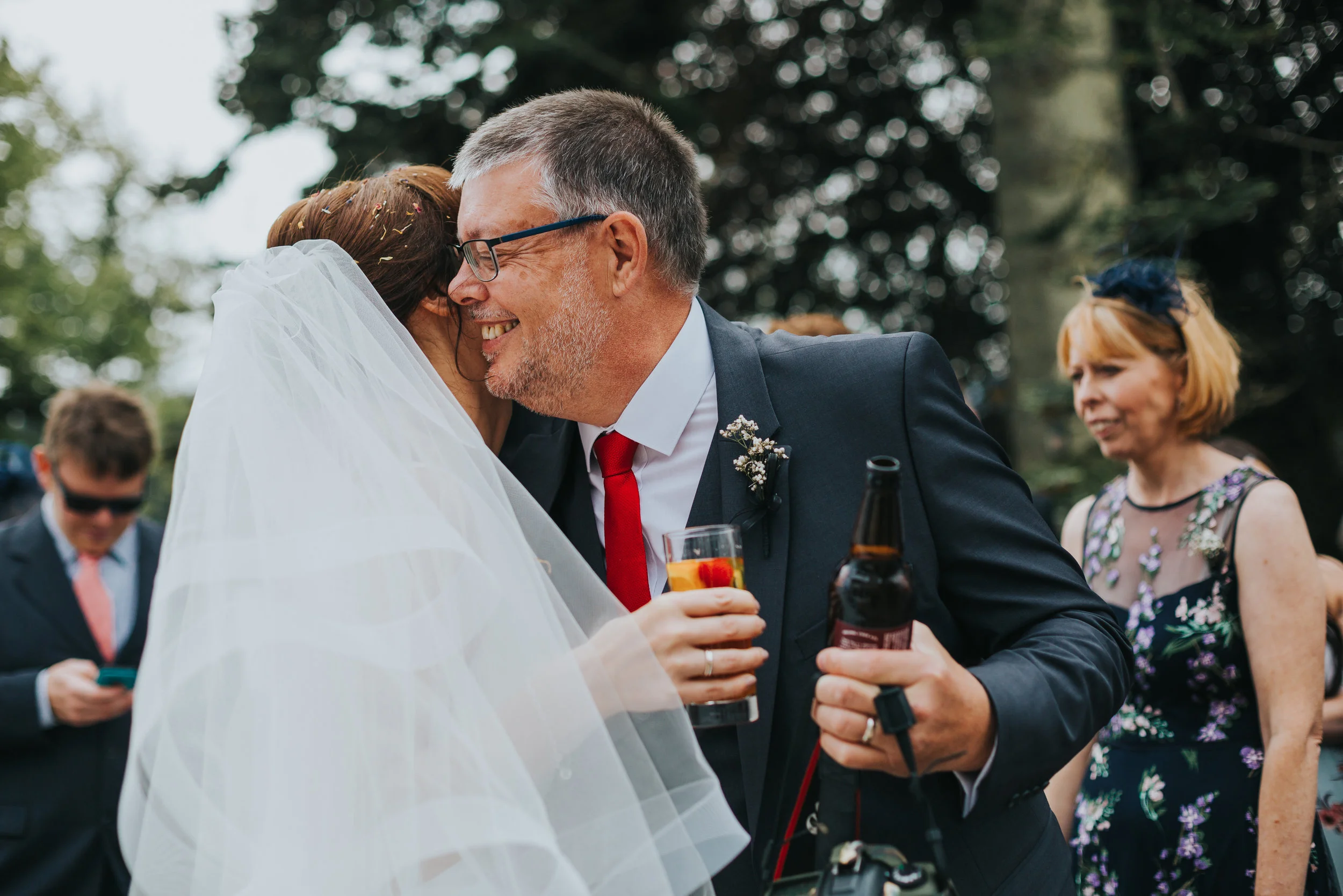 Bride hugs wedding guest.