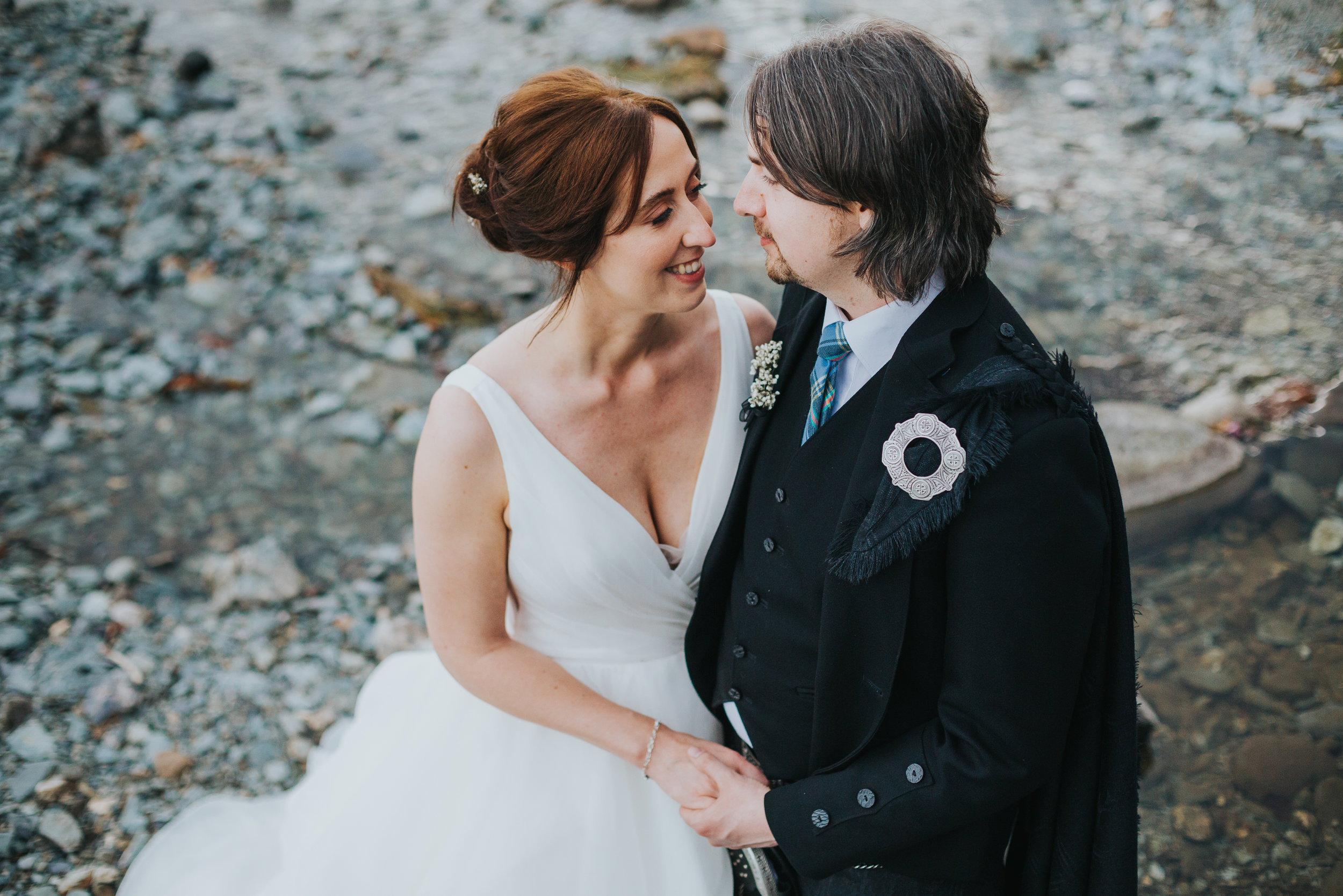 Bride and Groom have a romantic moment together, Loch Ard, Scotland. 