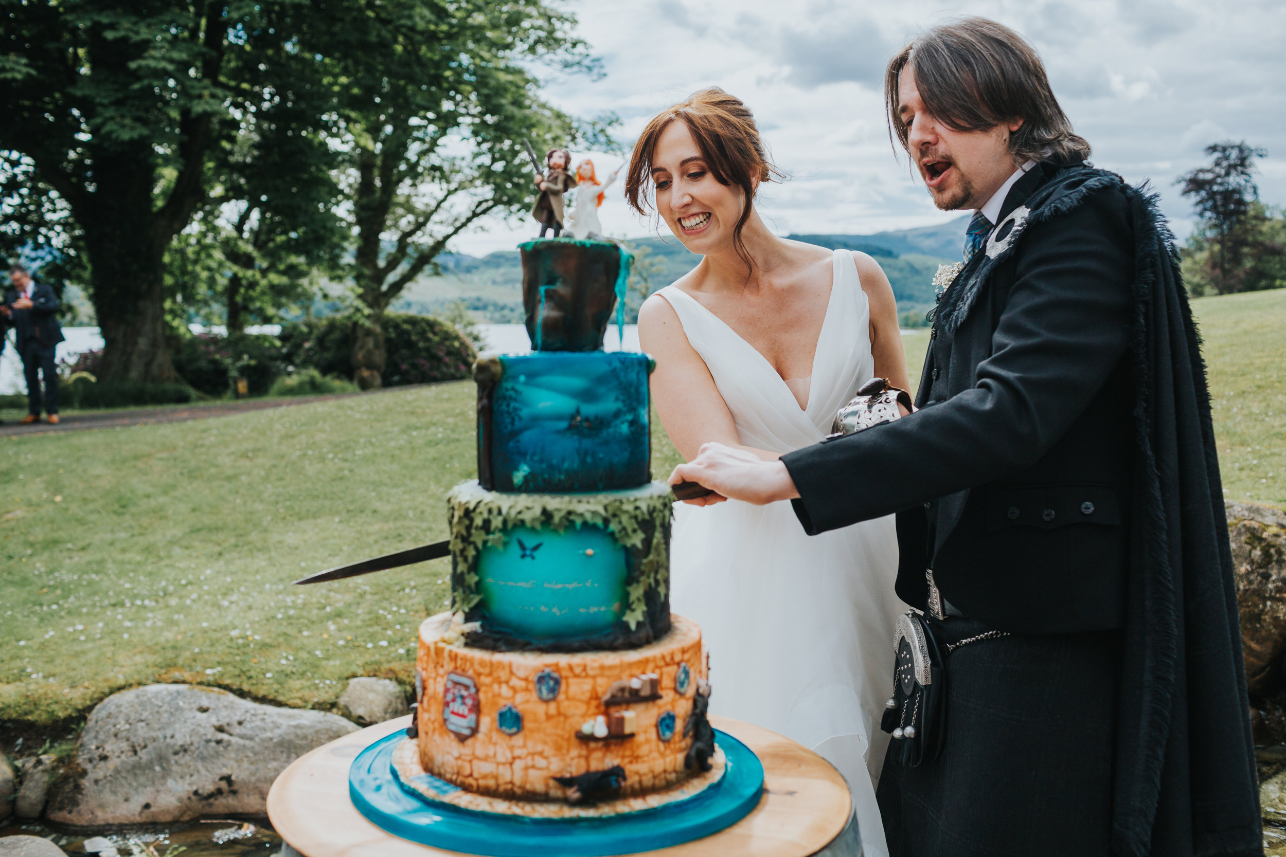 Bride and groom cut cake. 