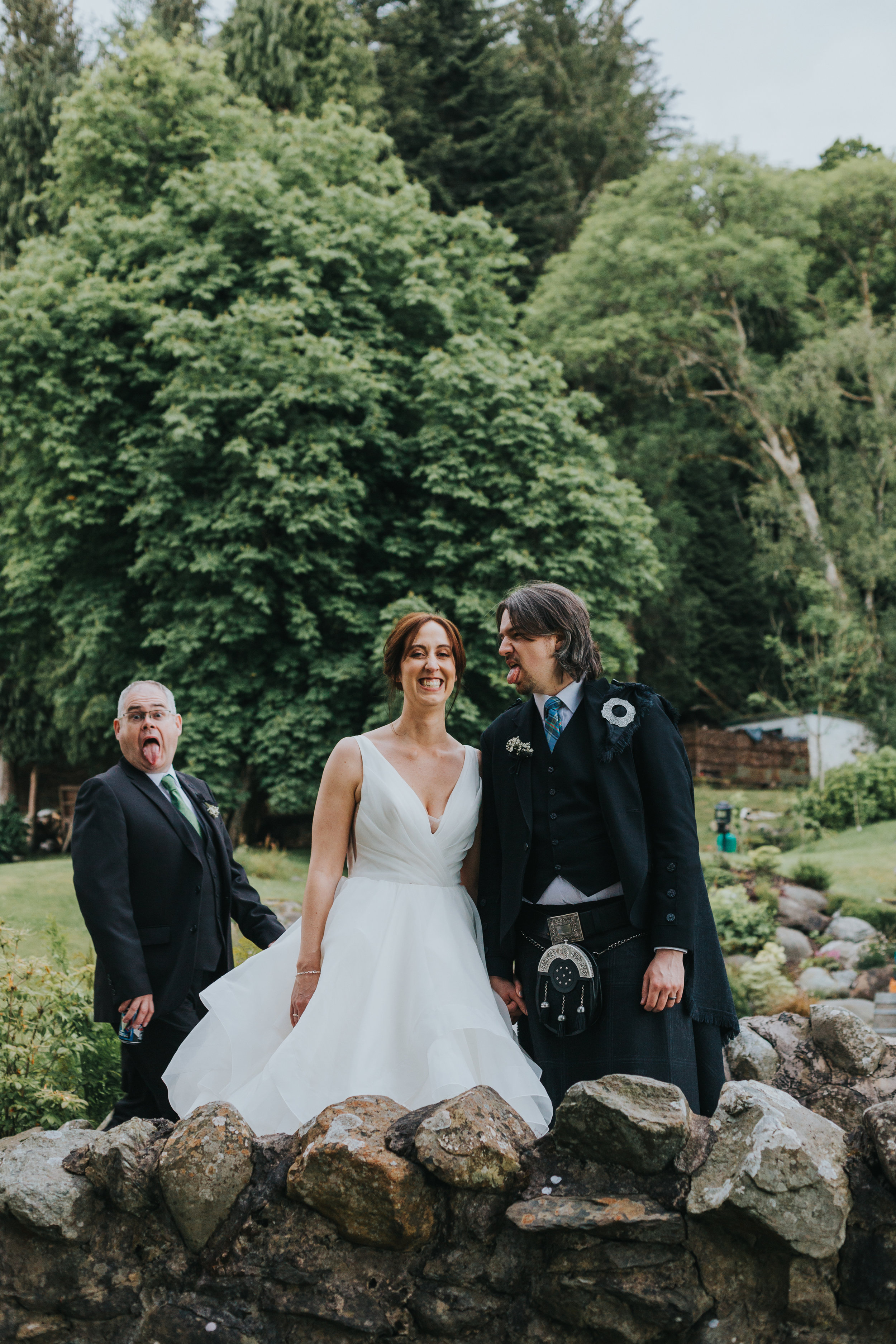 Guest photobombs bride and grooms wedding photographs. 