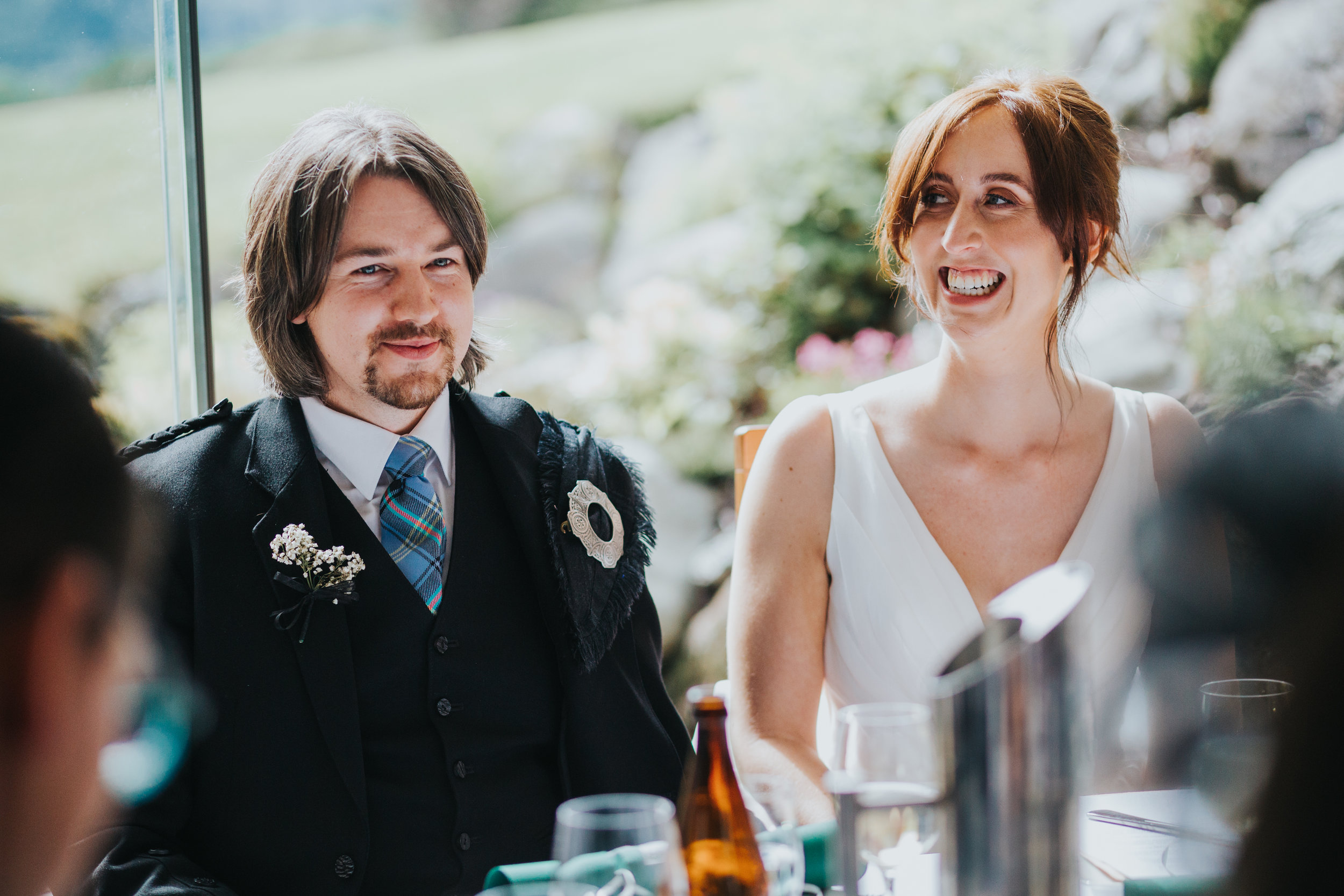 Bride and Groom sit for dinner