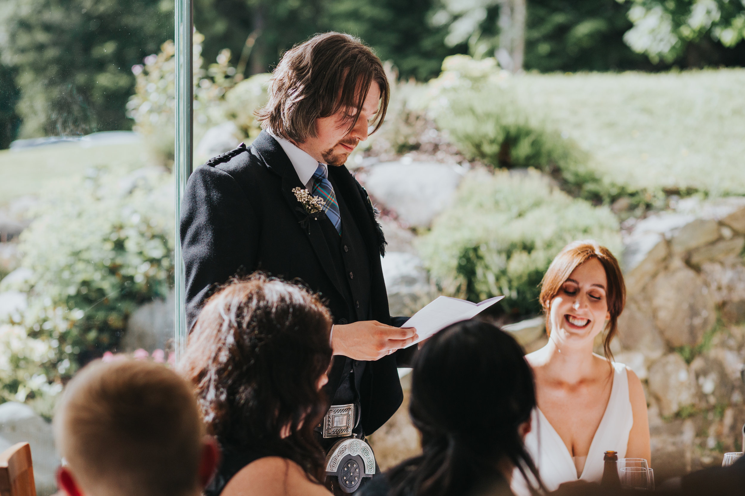 The groom gives his speech. 