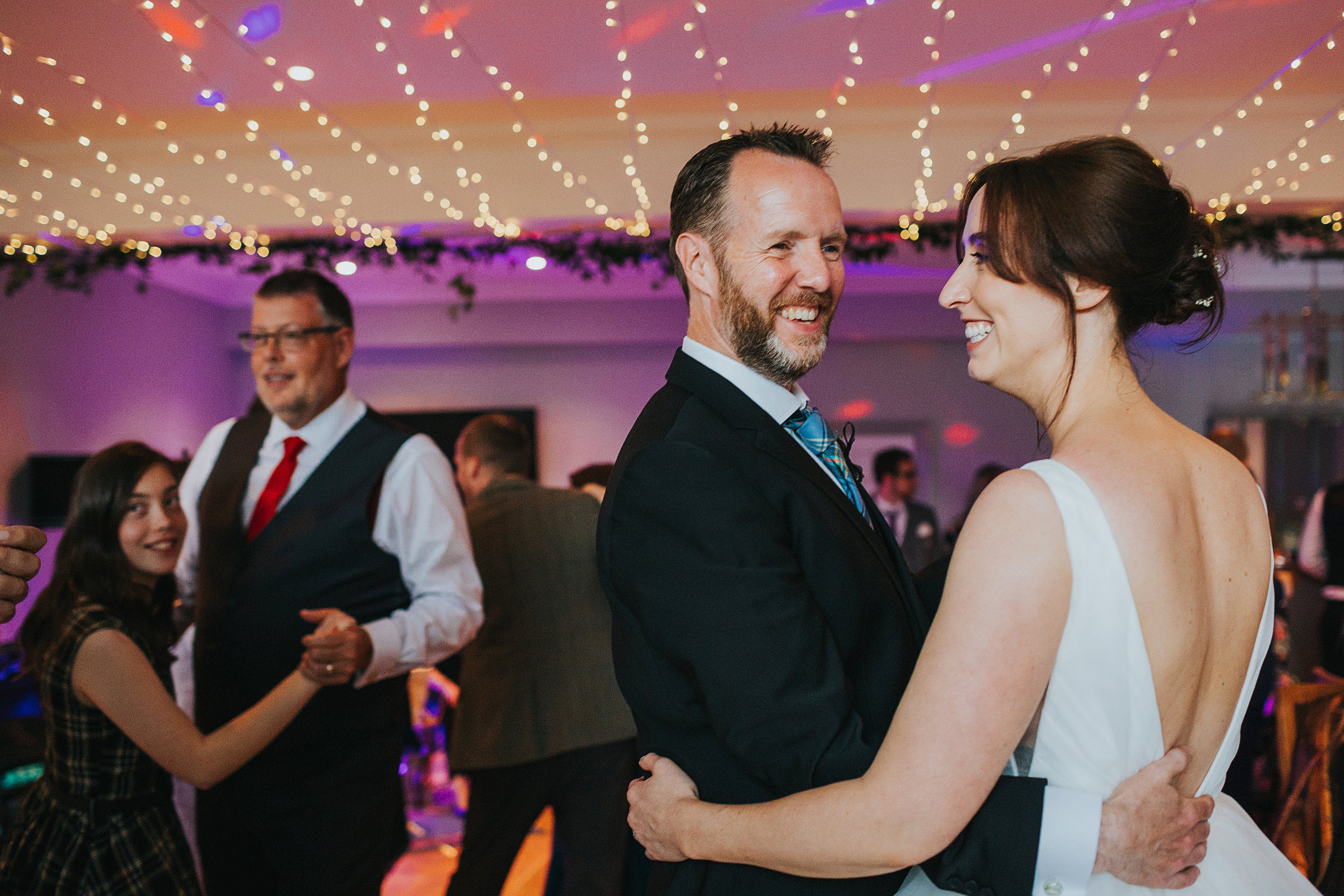 Bride and her brother share a dance. 