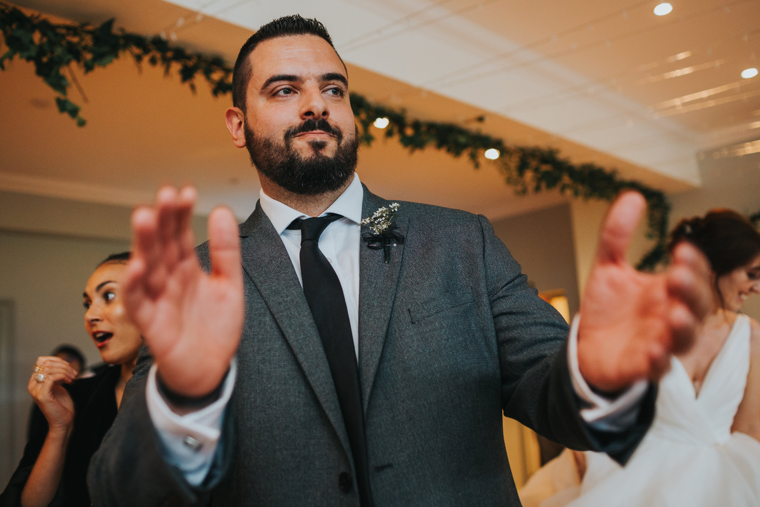 Wedding guest clap dancing.