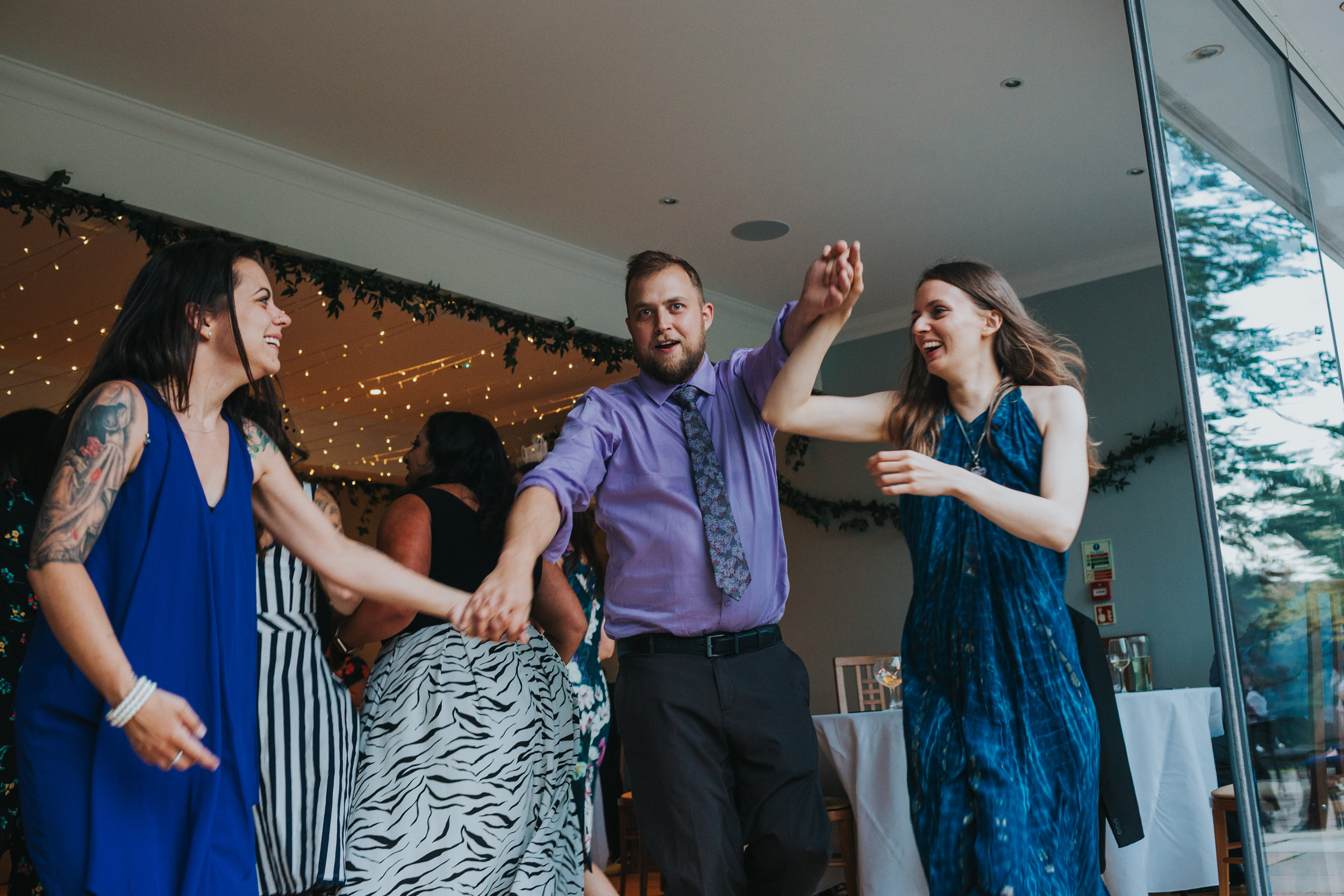 Wedding guests make some shapes. 