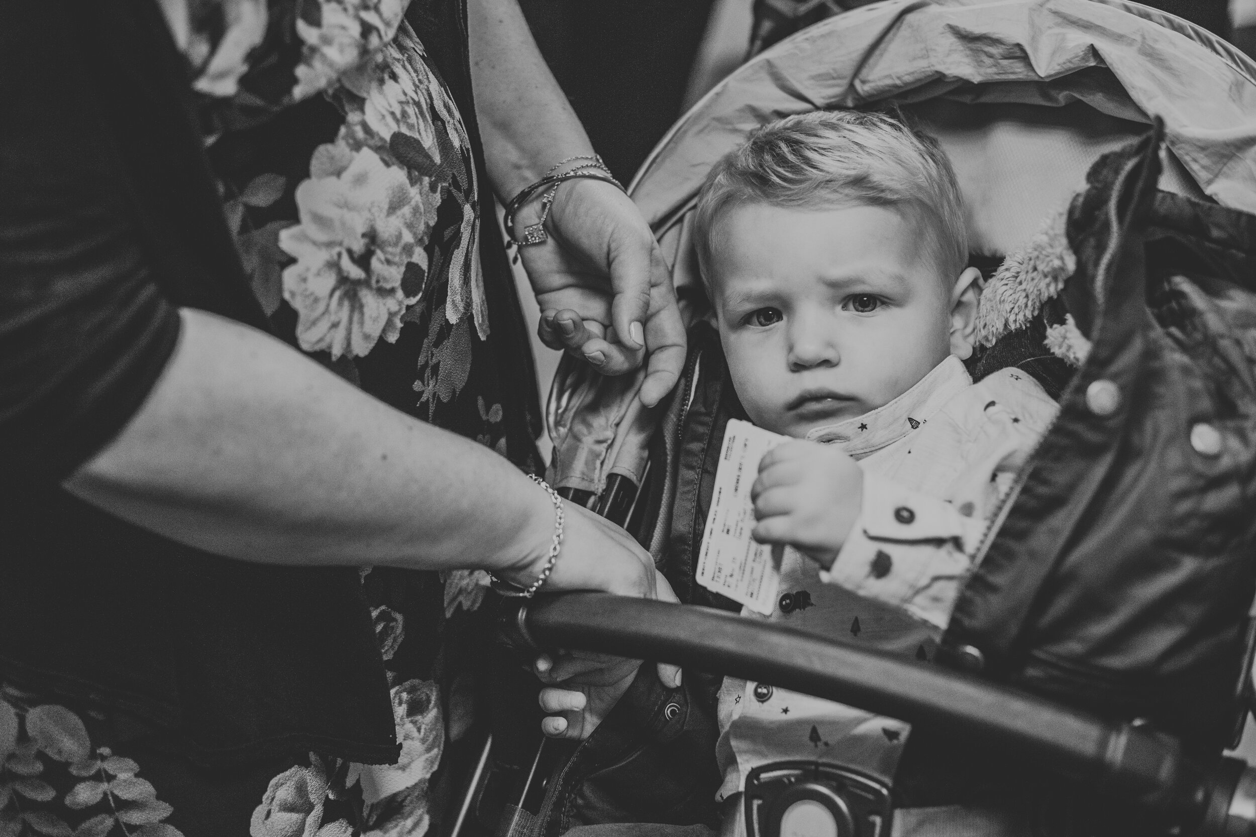 Black and white photo of a blonde boy in a pram.  (Copy)