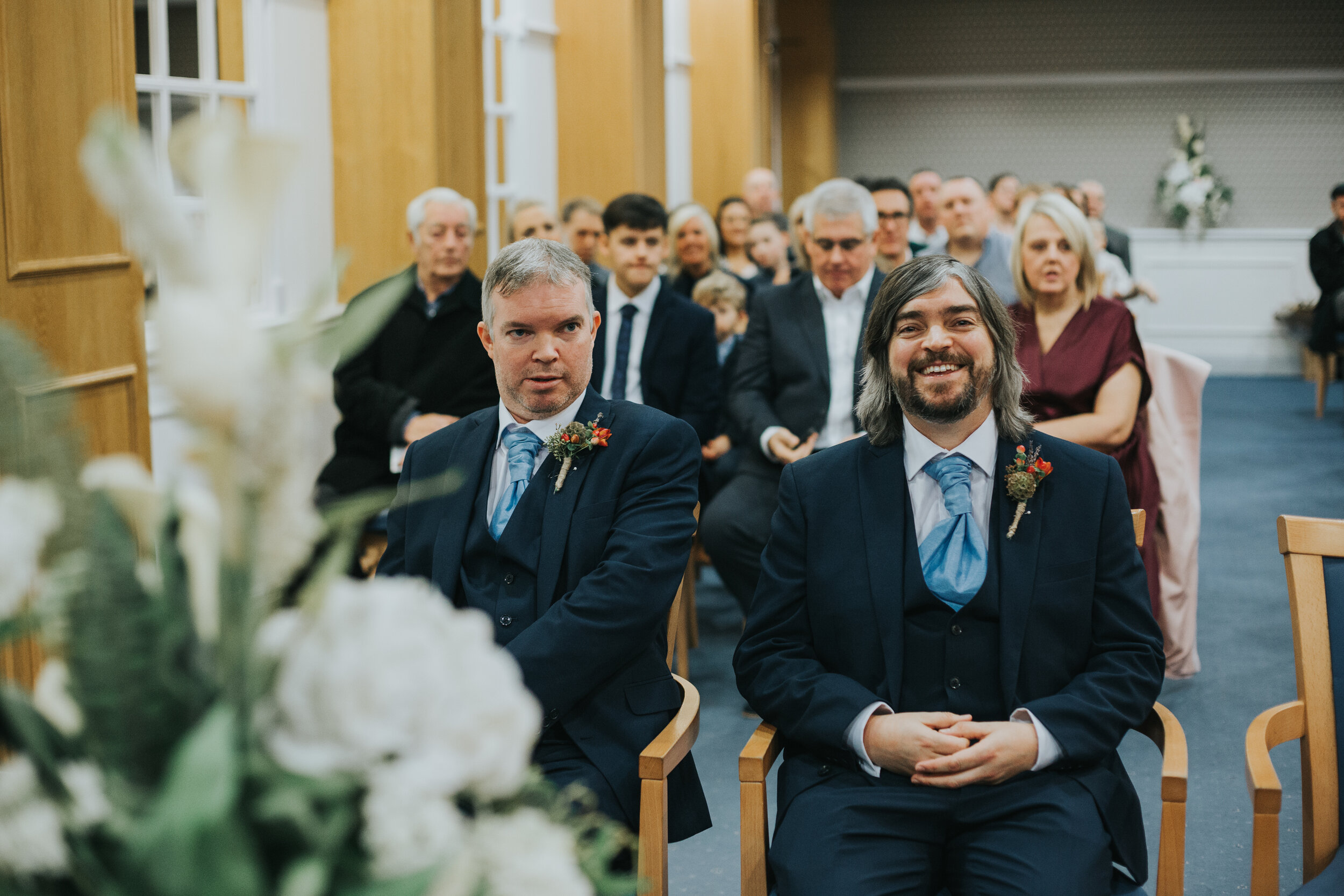 Groom smiles into the camera as he waits for his bride to arrive in Manchester registry office.  (Copy)