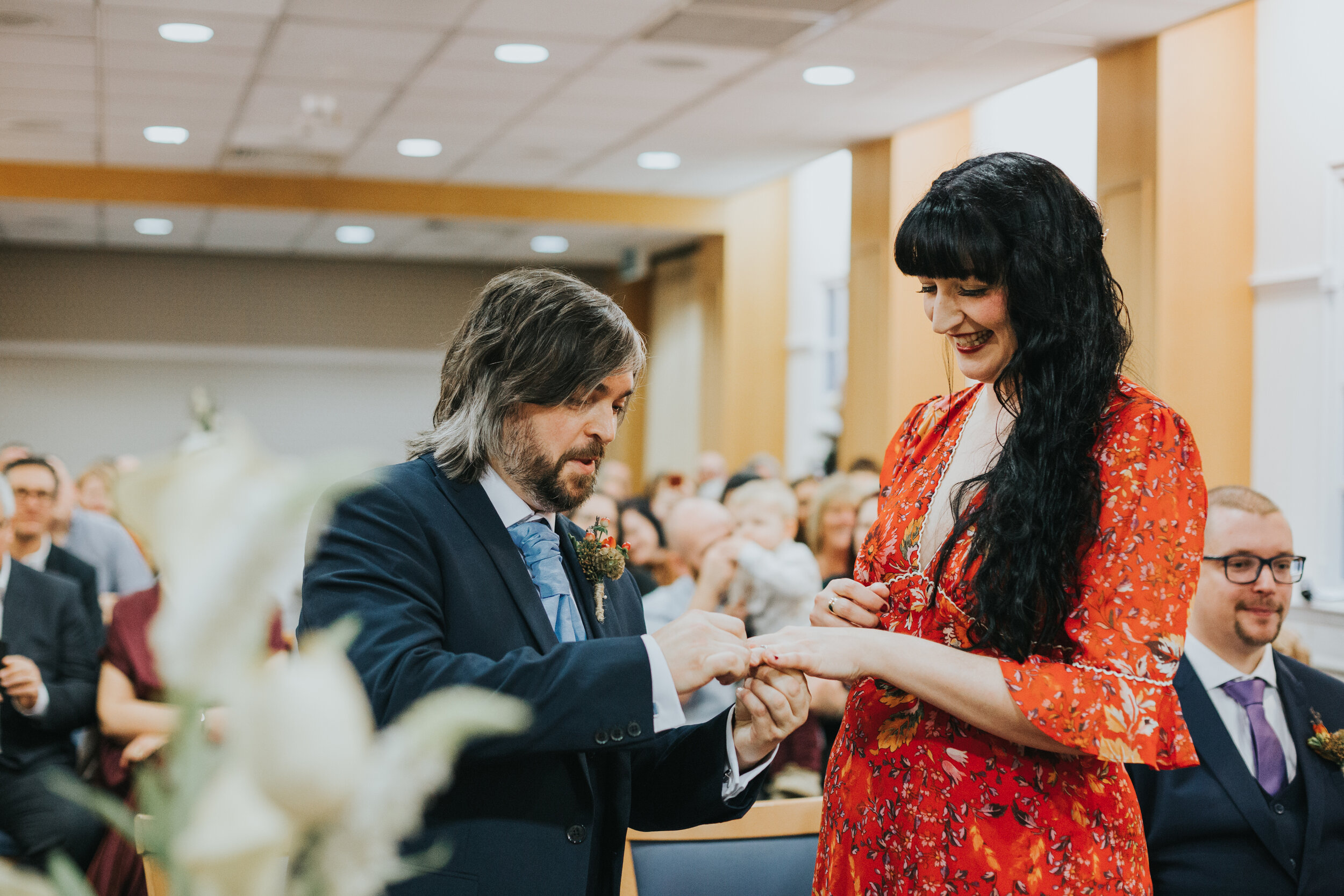 Bride and Groom exchange rings in Manchester registry office.  (Copy)