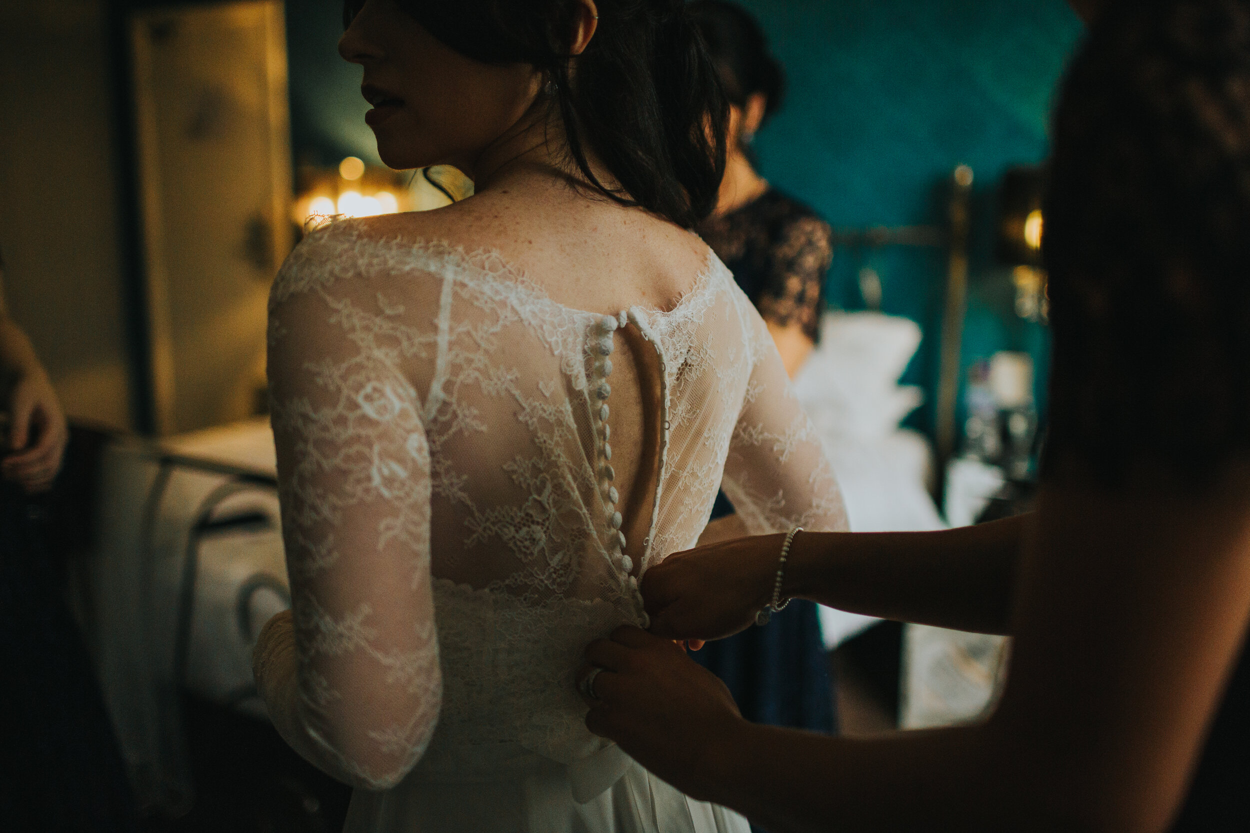 Close up of the back of the brides dress. 