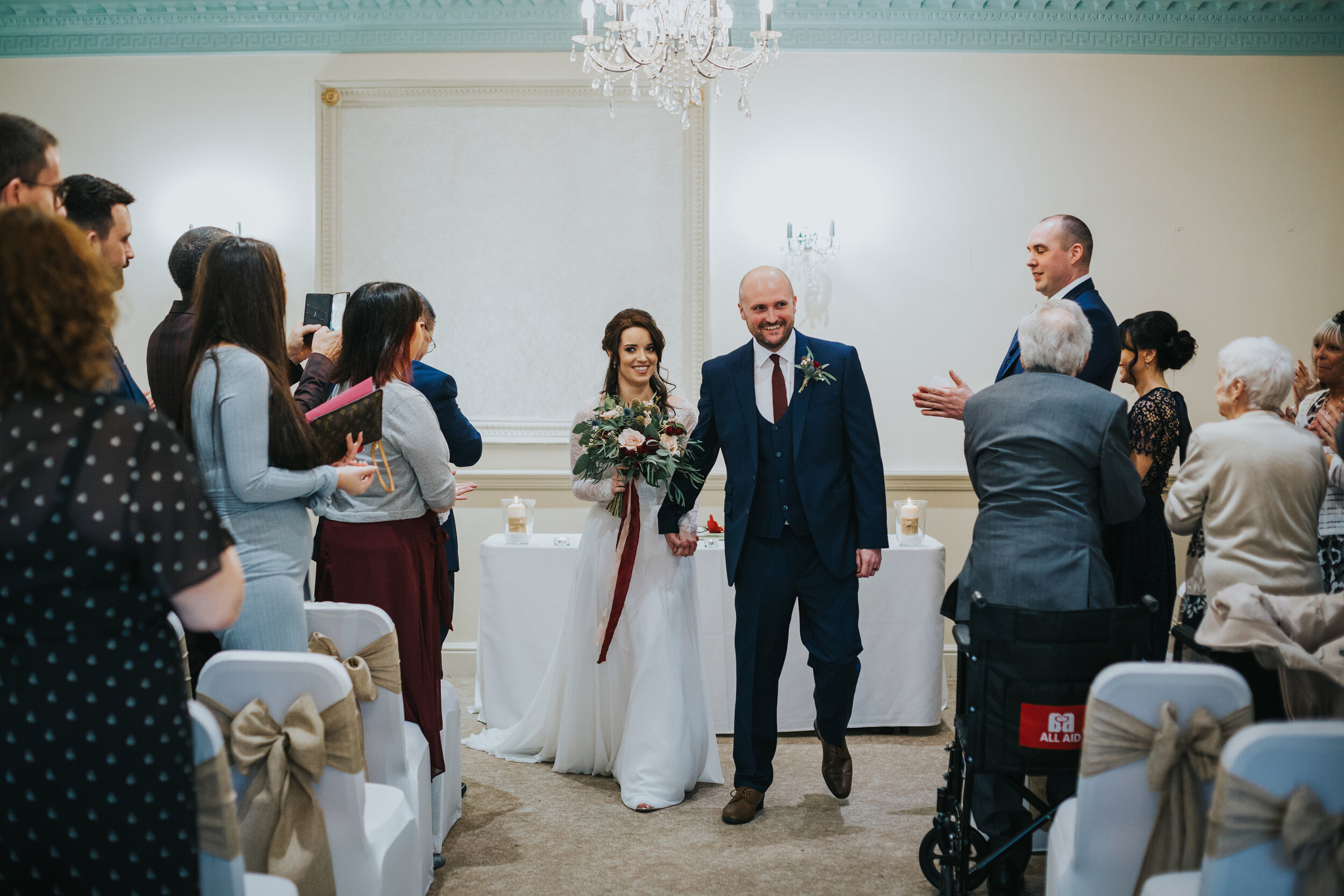 Bride and Groom face wedding guests as husband and wife. 