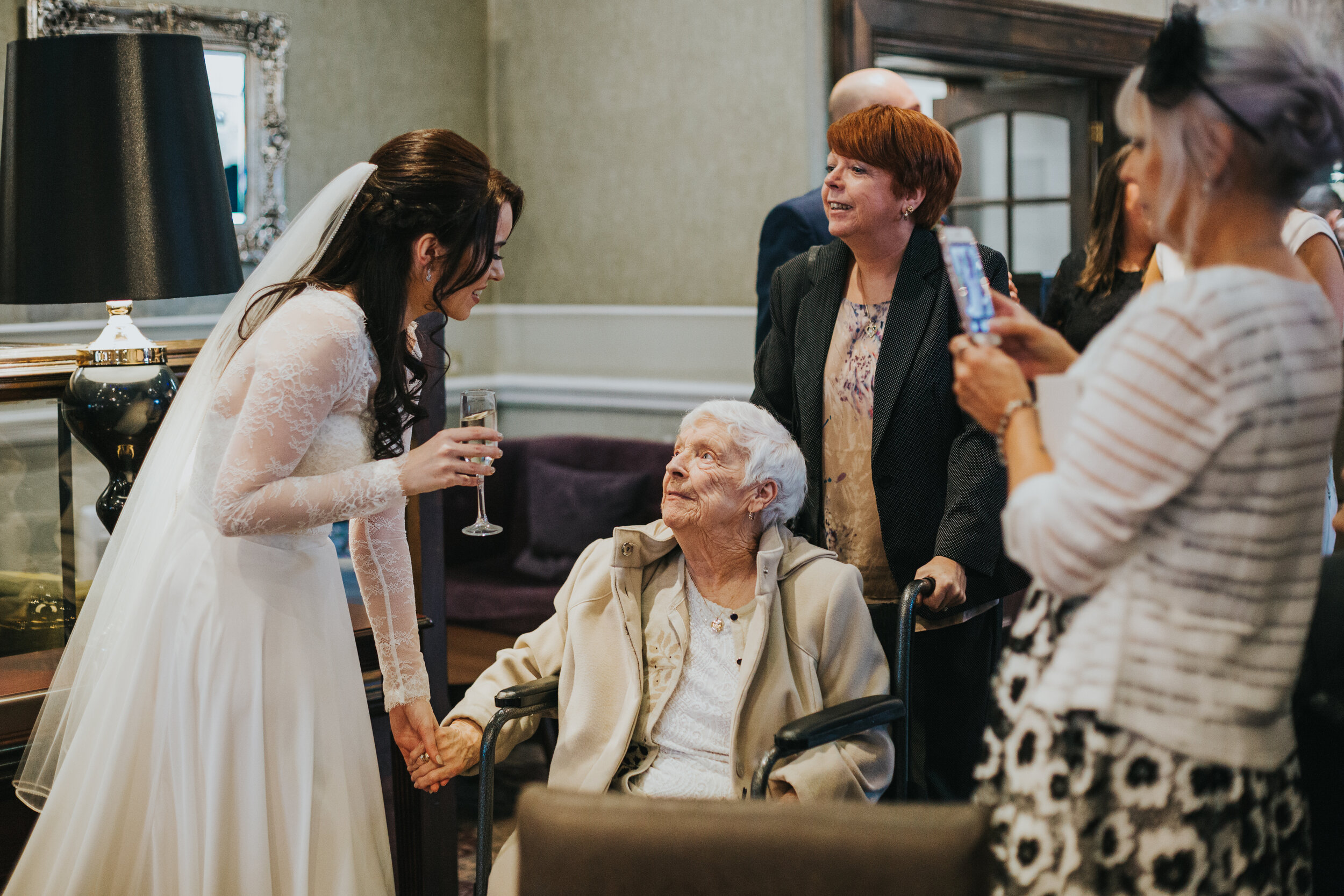 Bride greets her grandmother. 