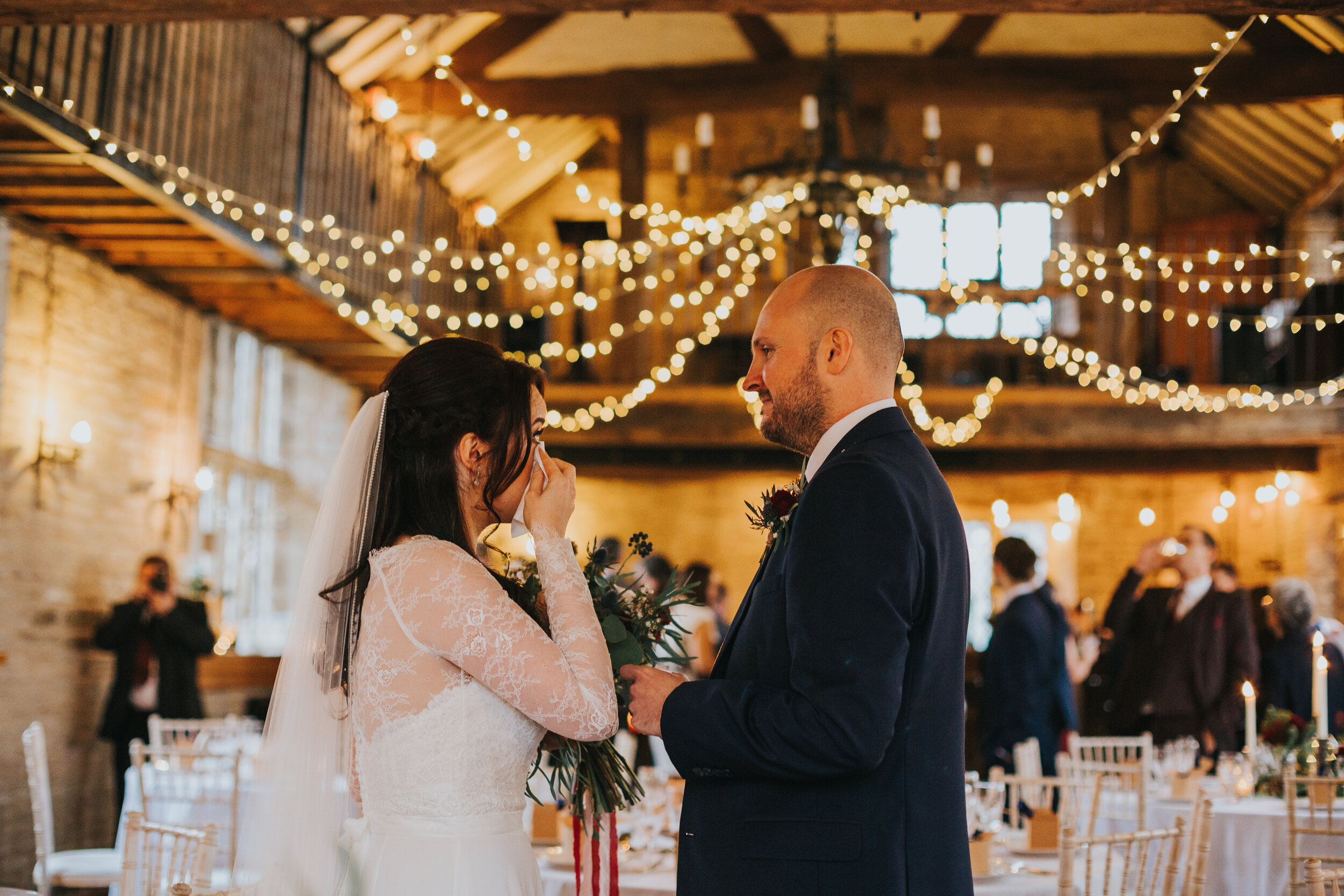 Bride cries at how beautiful the room looks. 