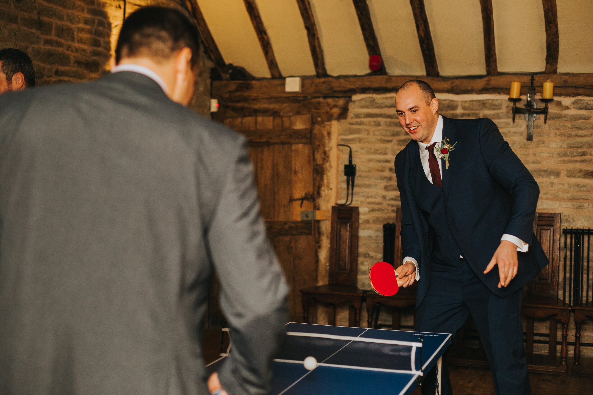 Best man plays ping pong. 