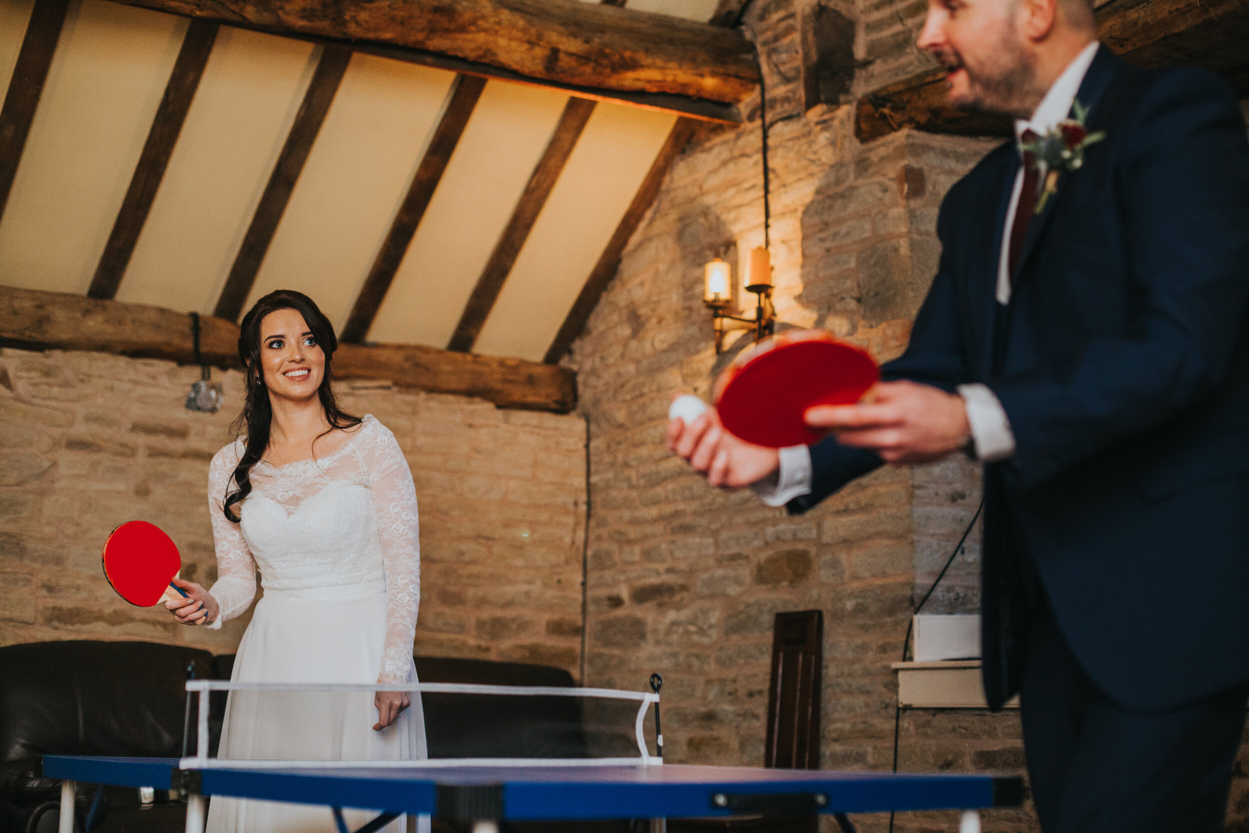 Bride plays ping pong. 