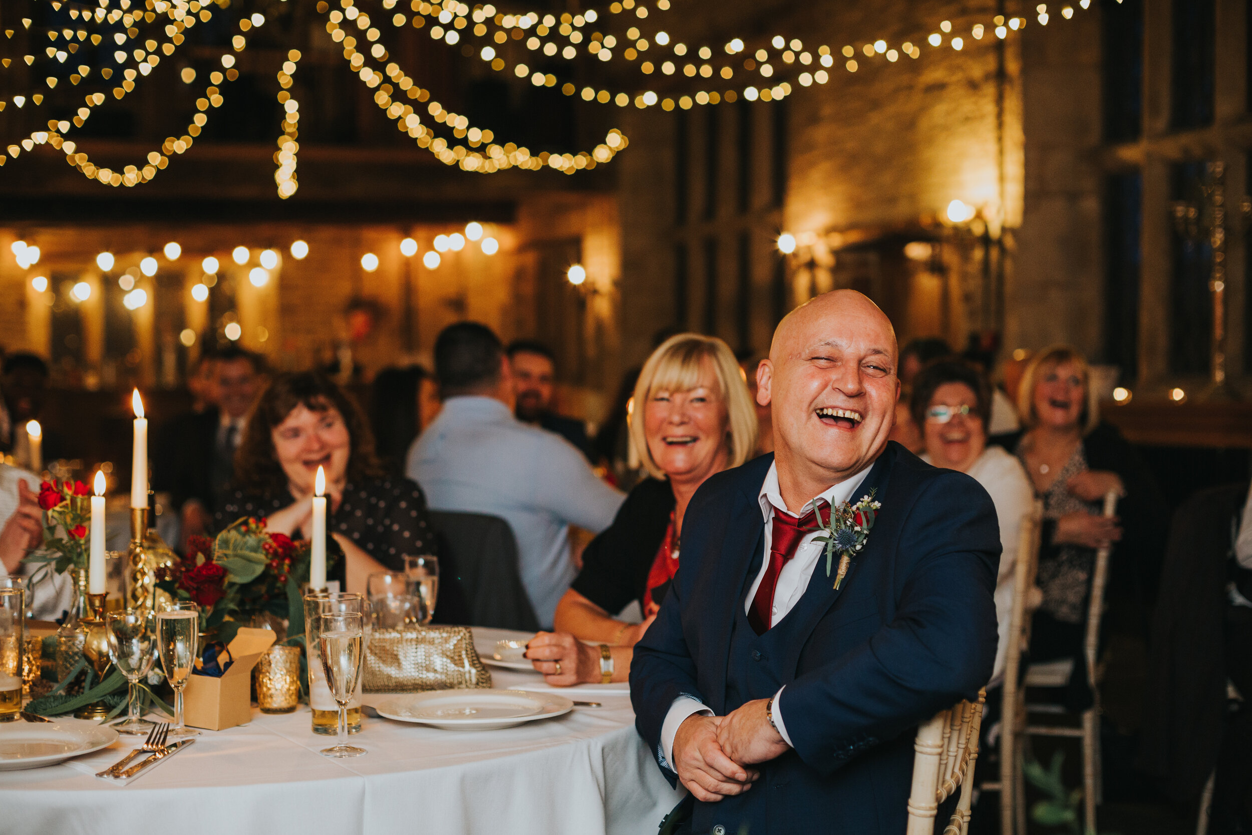 Wedding guest having a good laugh. 