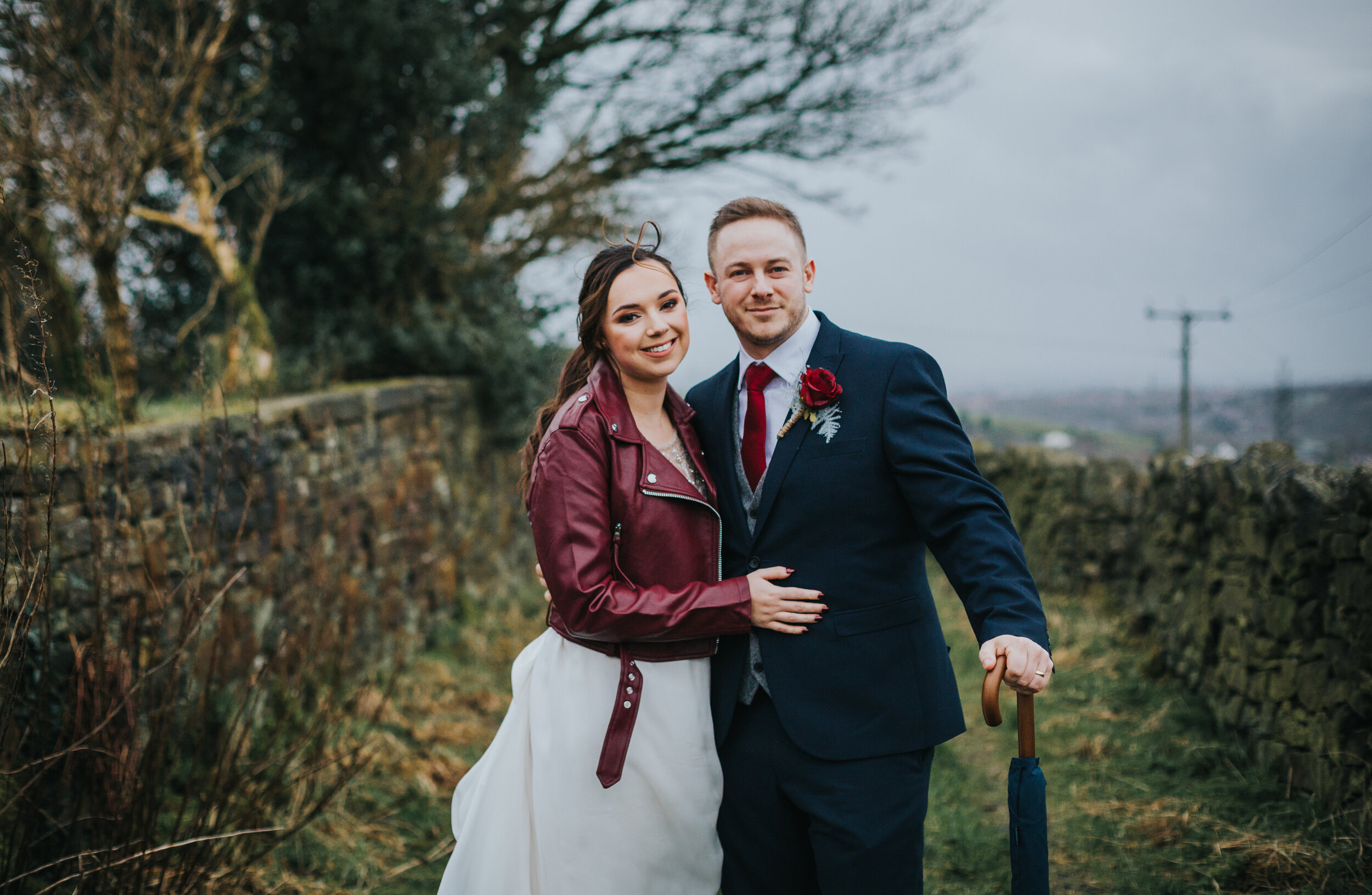 Bride and groom have a country file style photo. 