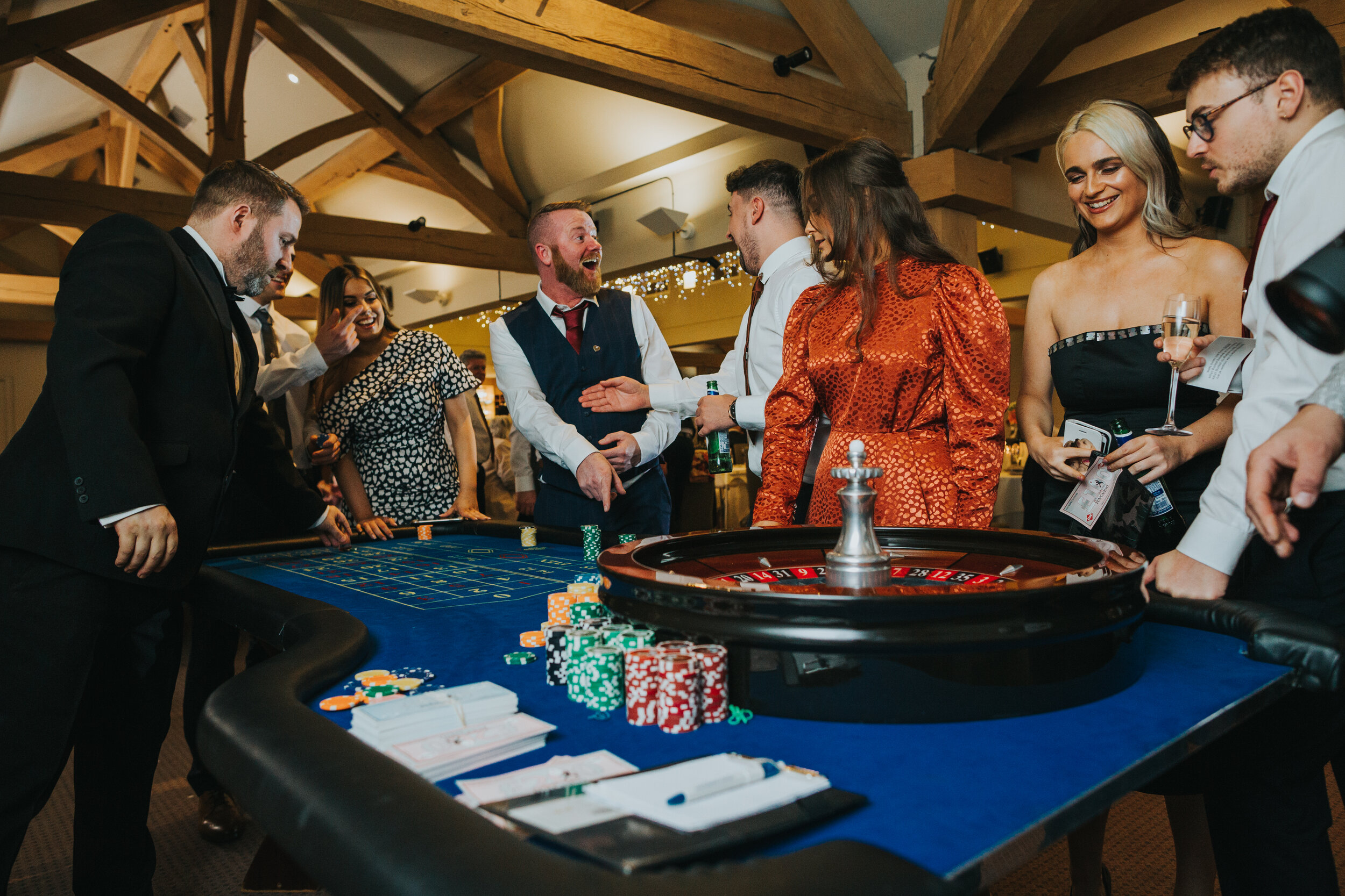 Guests have fun playing casino games, a gift to the groom from the bride. 