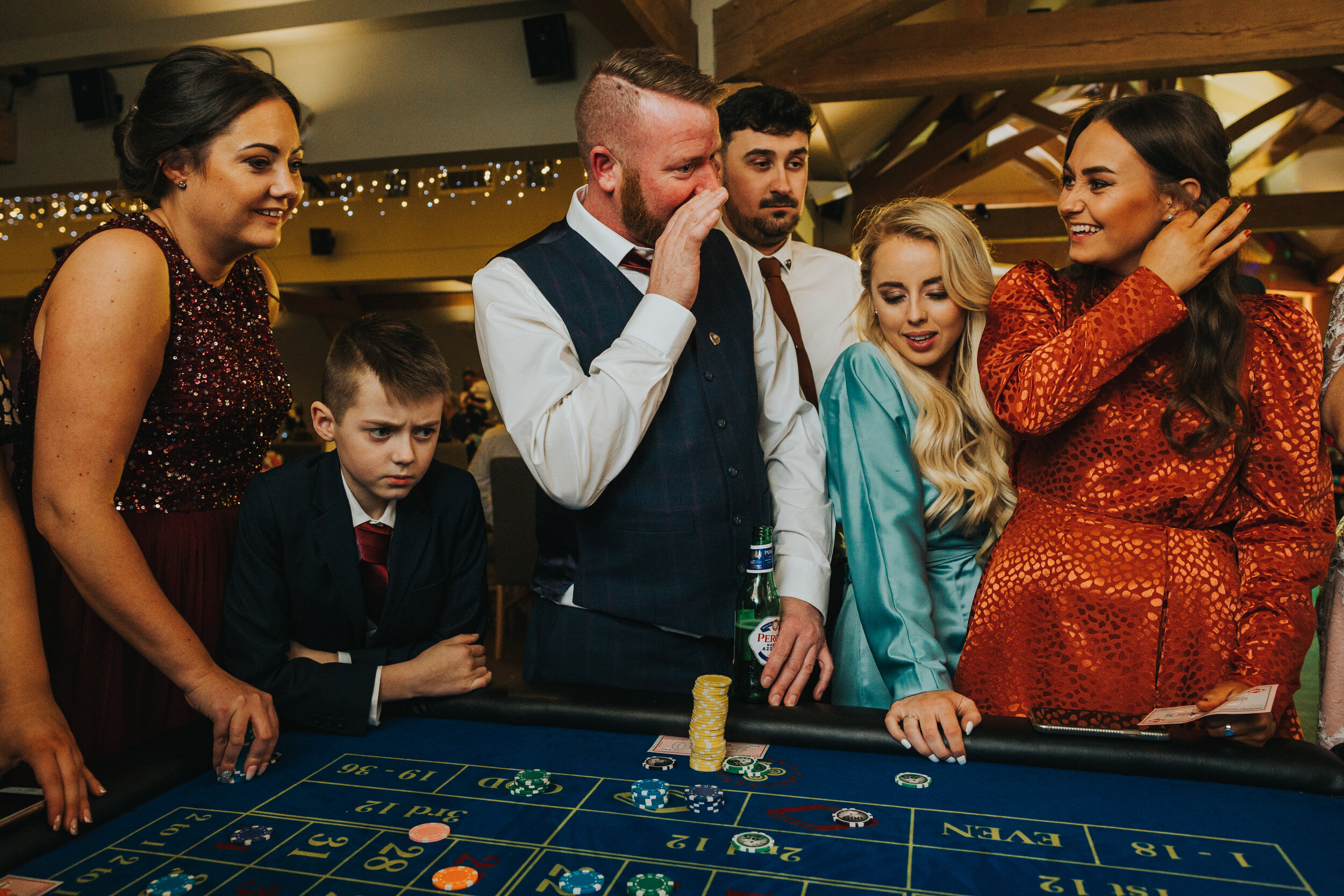 Guests looking glamorous at Casino tables. 