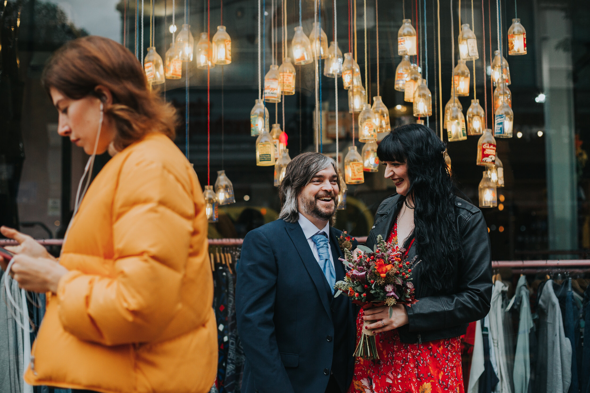 Bride and Groom outside shop window on Oldham Street, Manchester. (Copy)