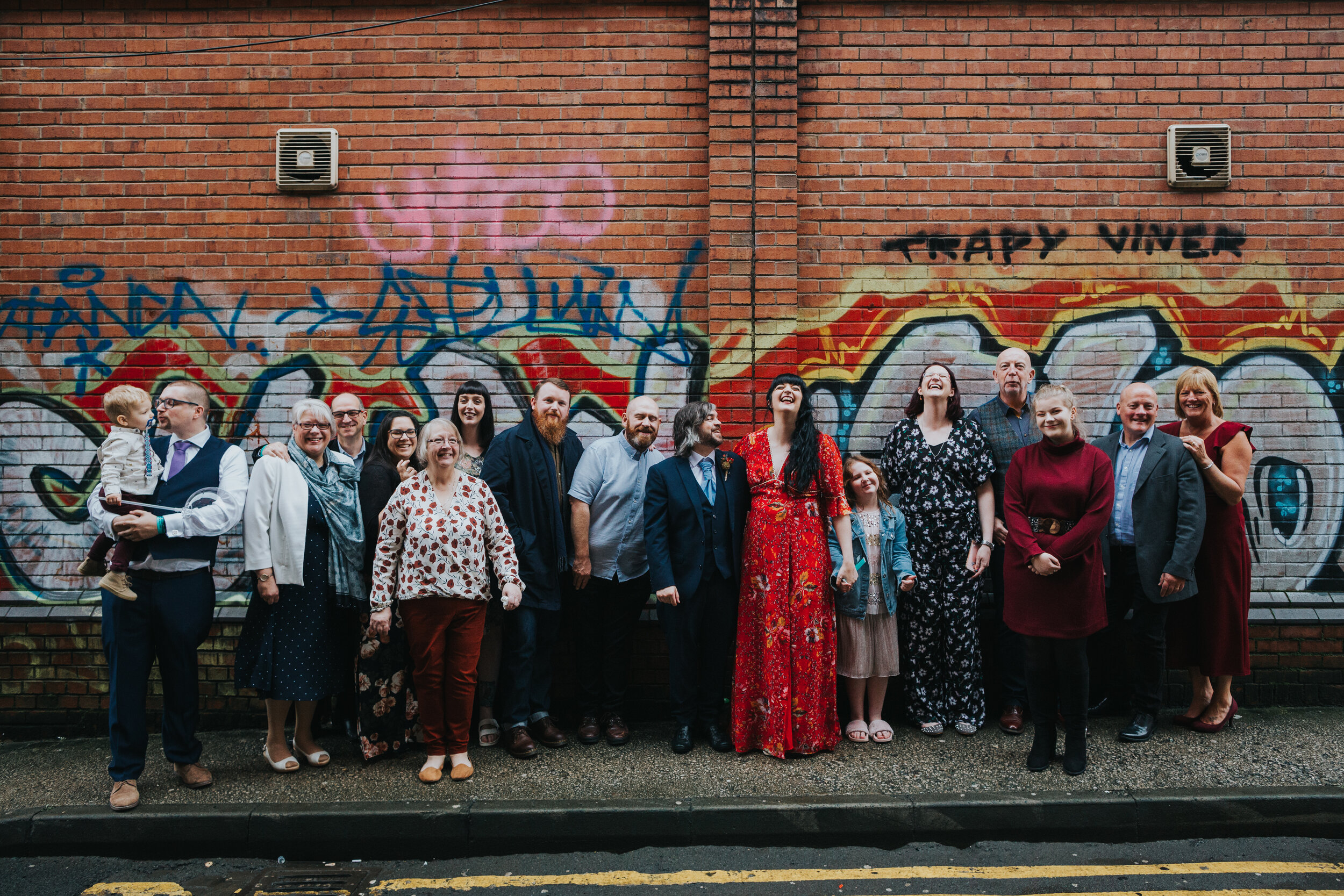 Group shot in front of graffiti.  (Copy)