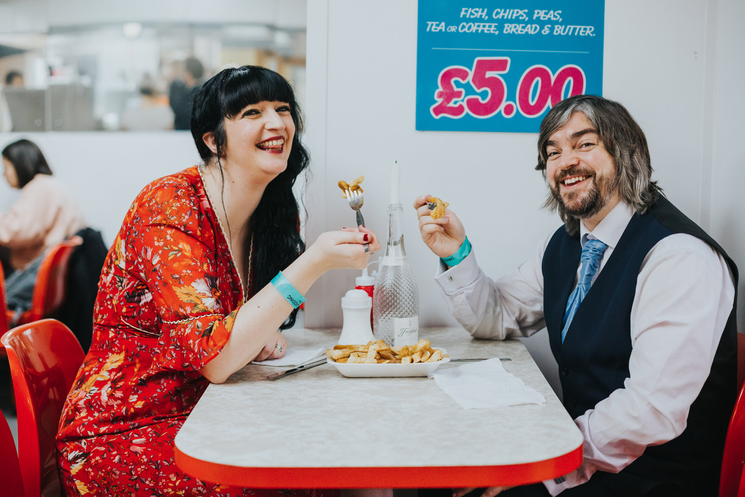 Bride and Groom eat their chippy tea on their wedding day in Manchester. (Copy)