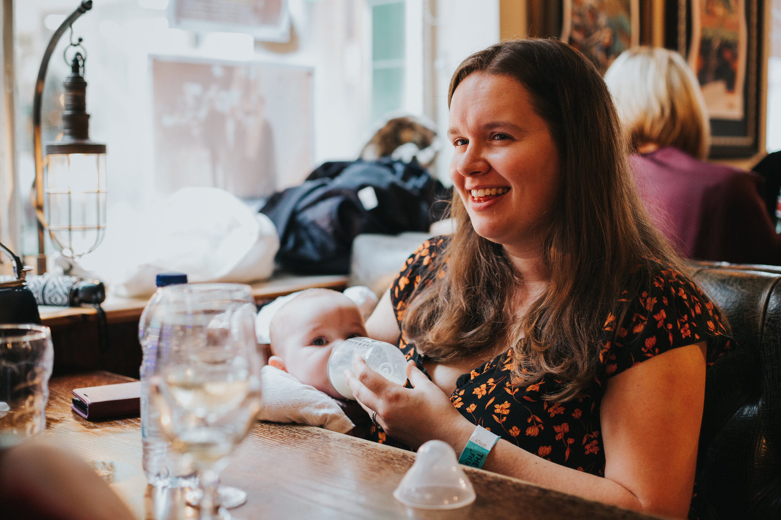 Wedding guest feeding her baby.  (Copy)