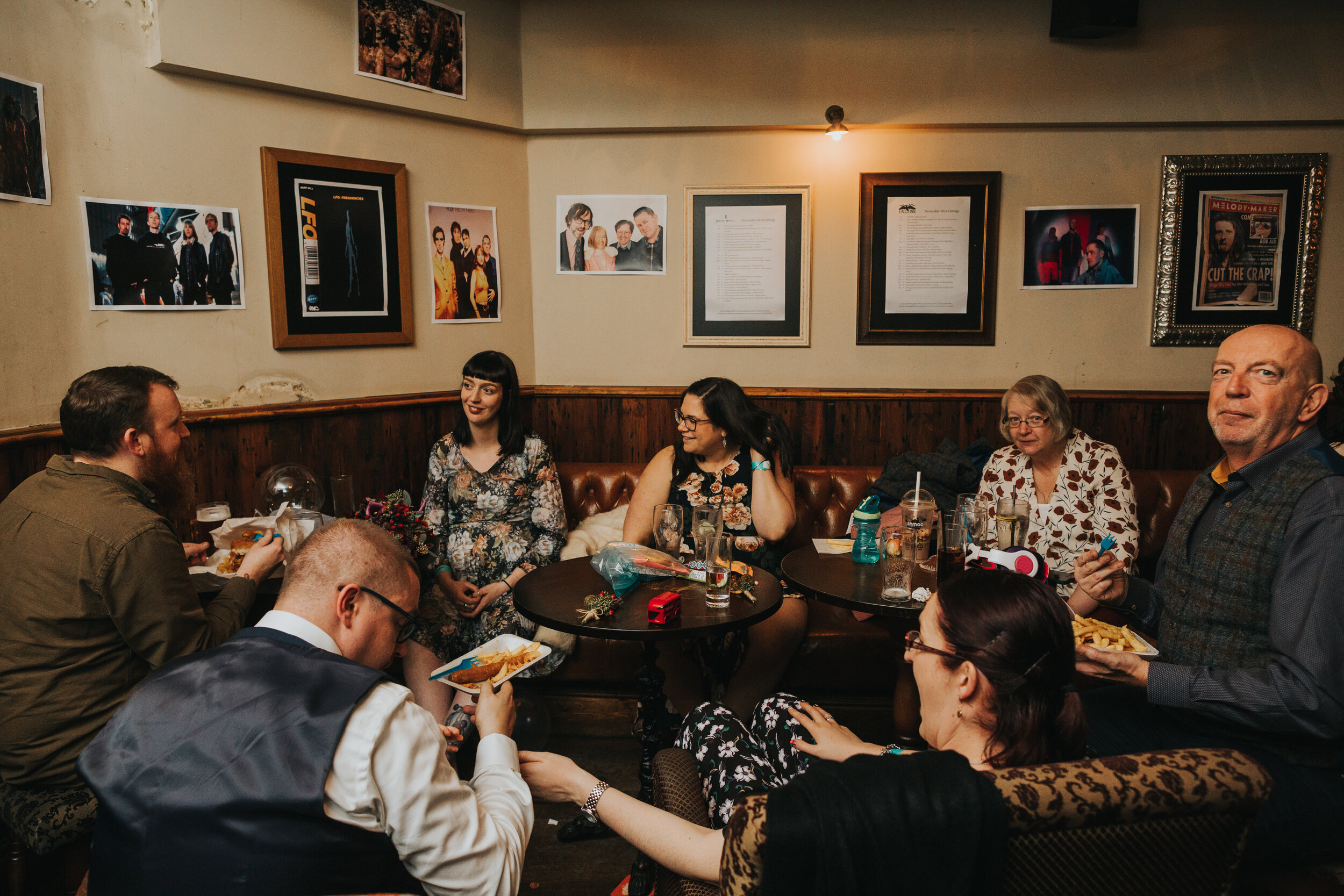 Wedding guests eat their chippy tea in pub snug.  (Copy)