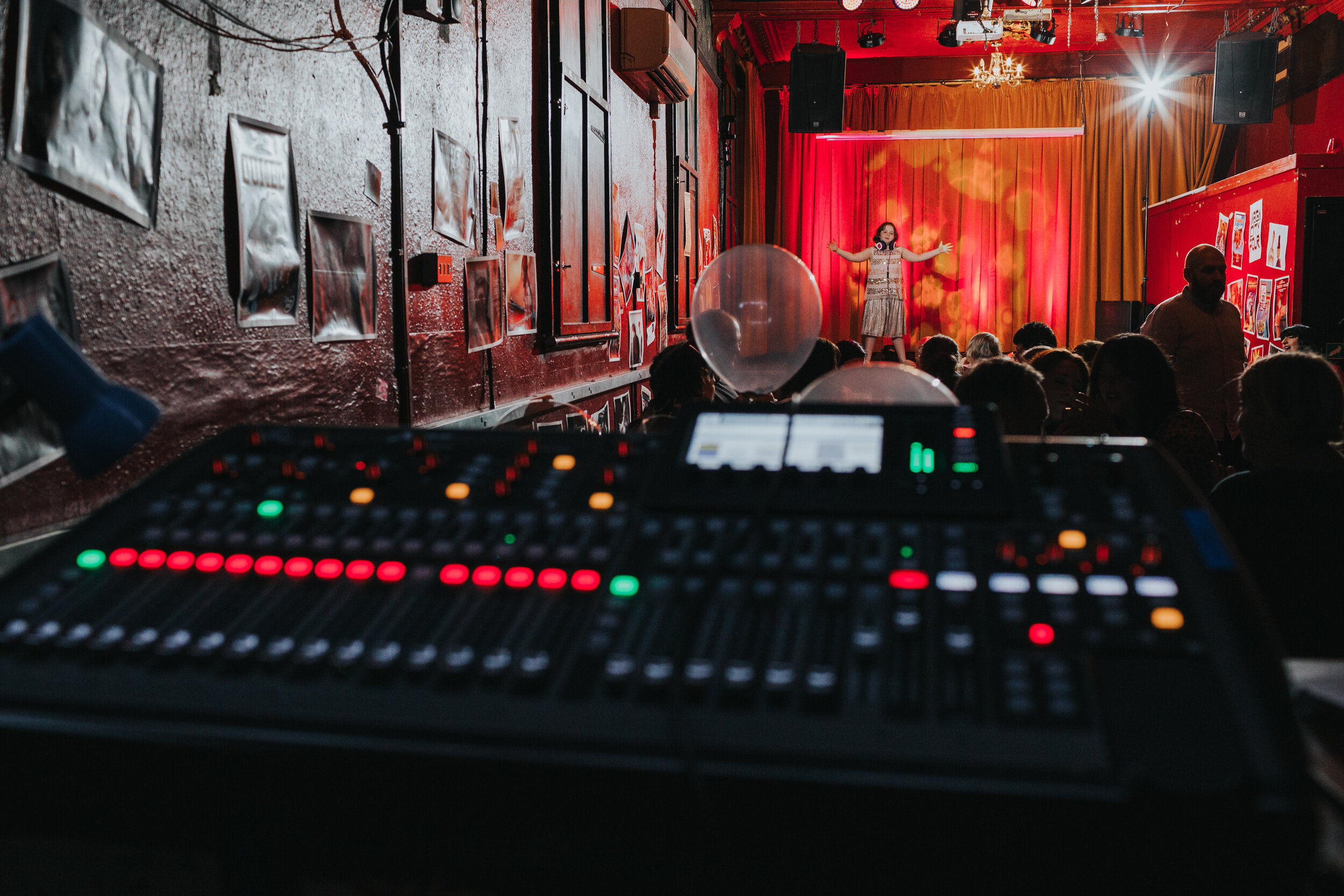 Child dancing on stage photographed from mixing desk.  (Copy)