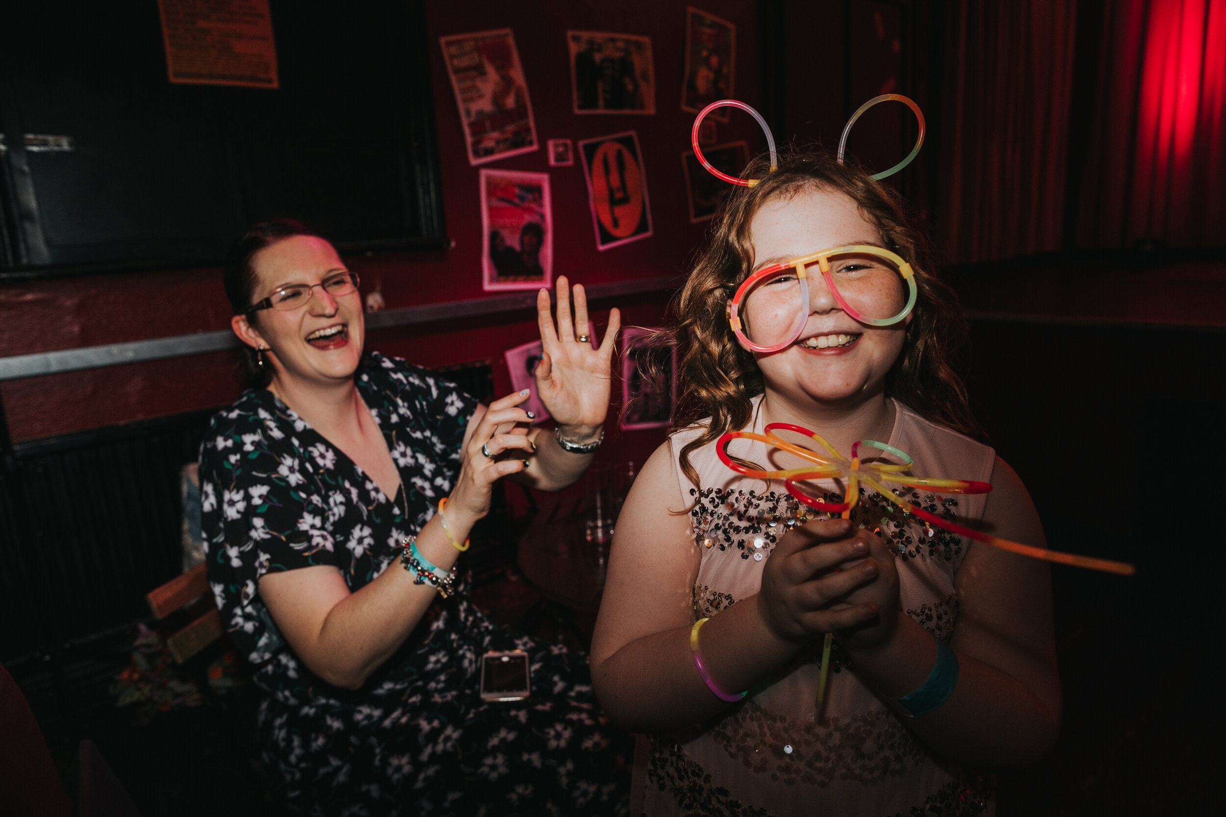 Child wearing glow stick bunny ears and glasses at pub wedding party.  (Copy)