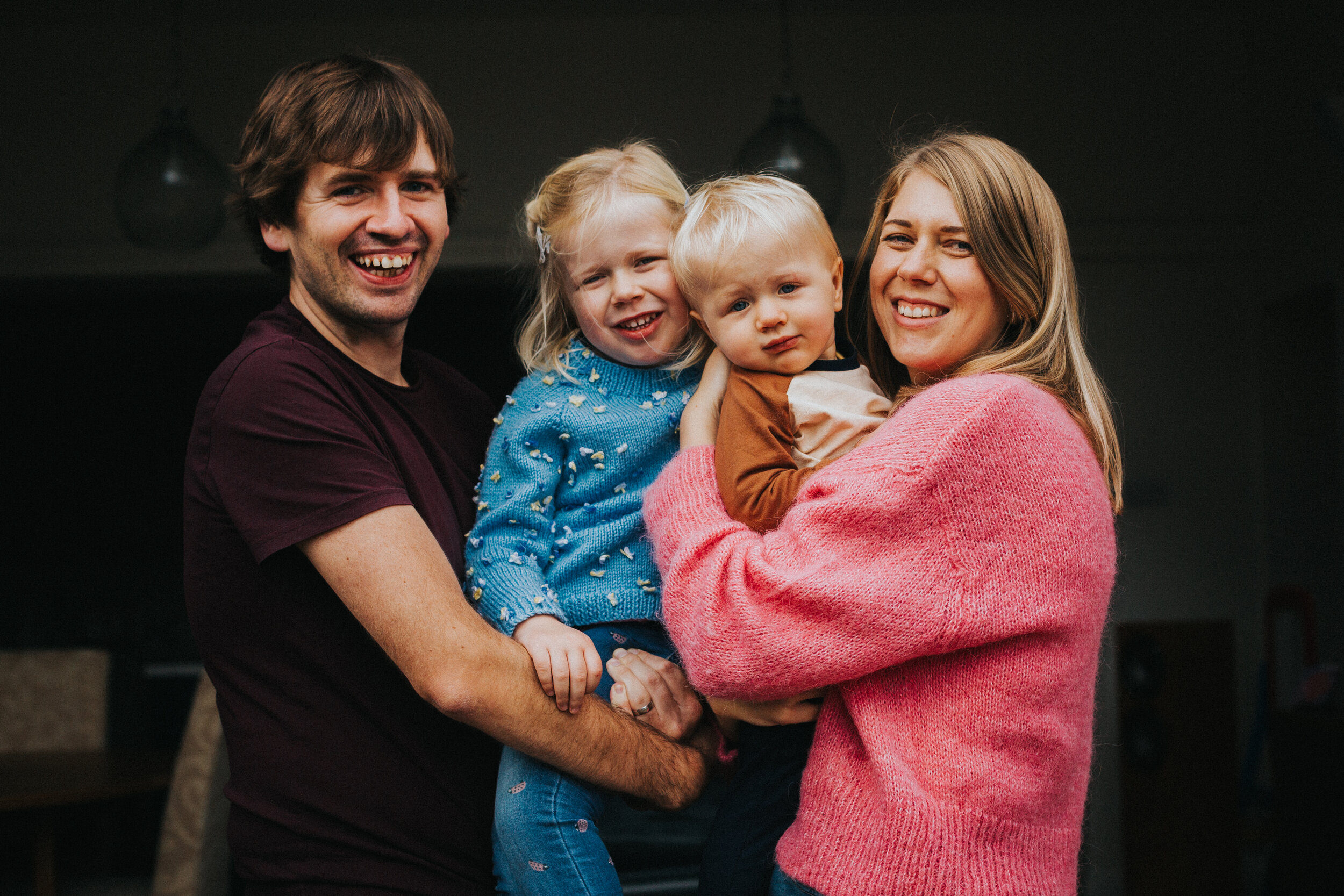 Family stand together for a photo.