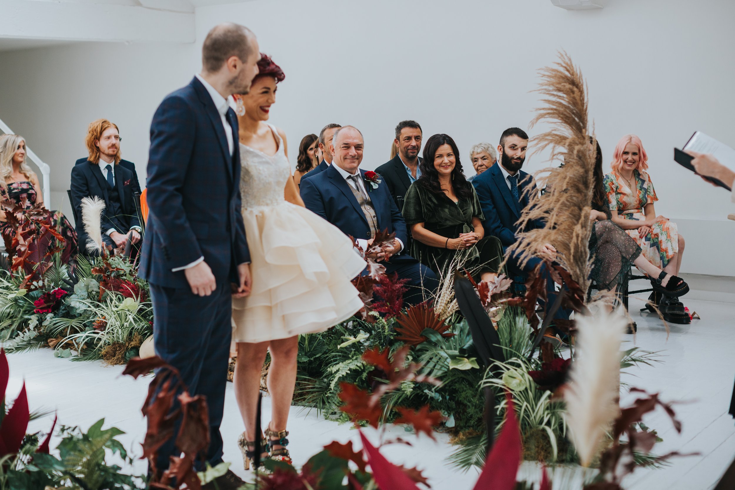 Mother of the bride gives her daughter a knowing smile. 