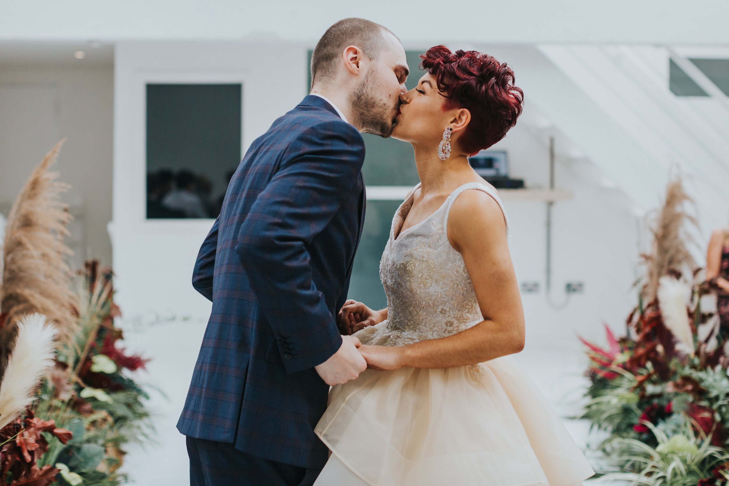 Bride and groom kiss.