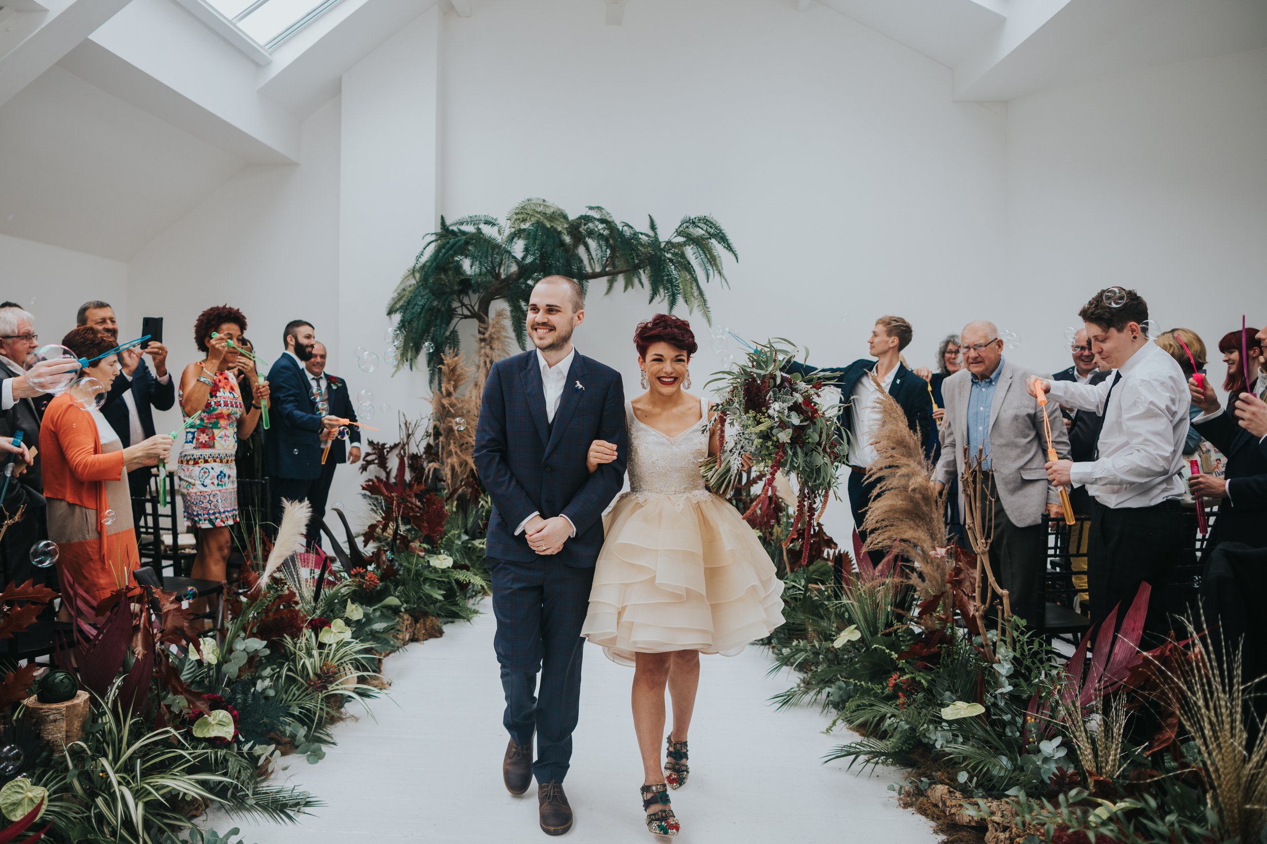 Bride and Groom exit their wedding ceremony at Five Four Studio Salford as husband and wife.