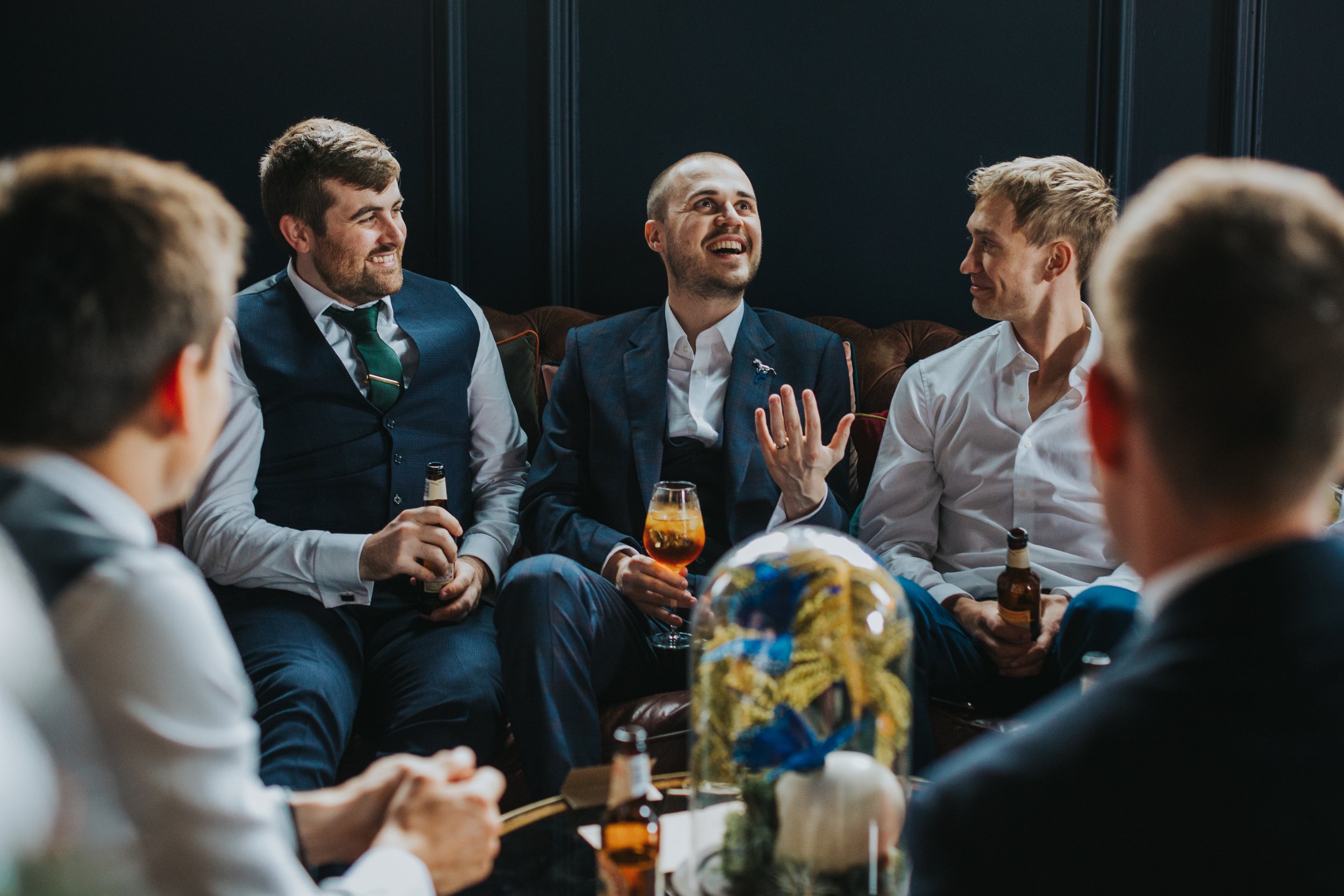 Groom tells a story to his friends. 