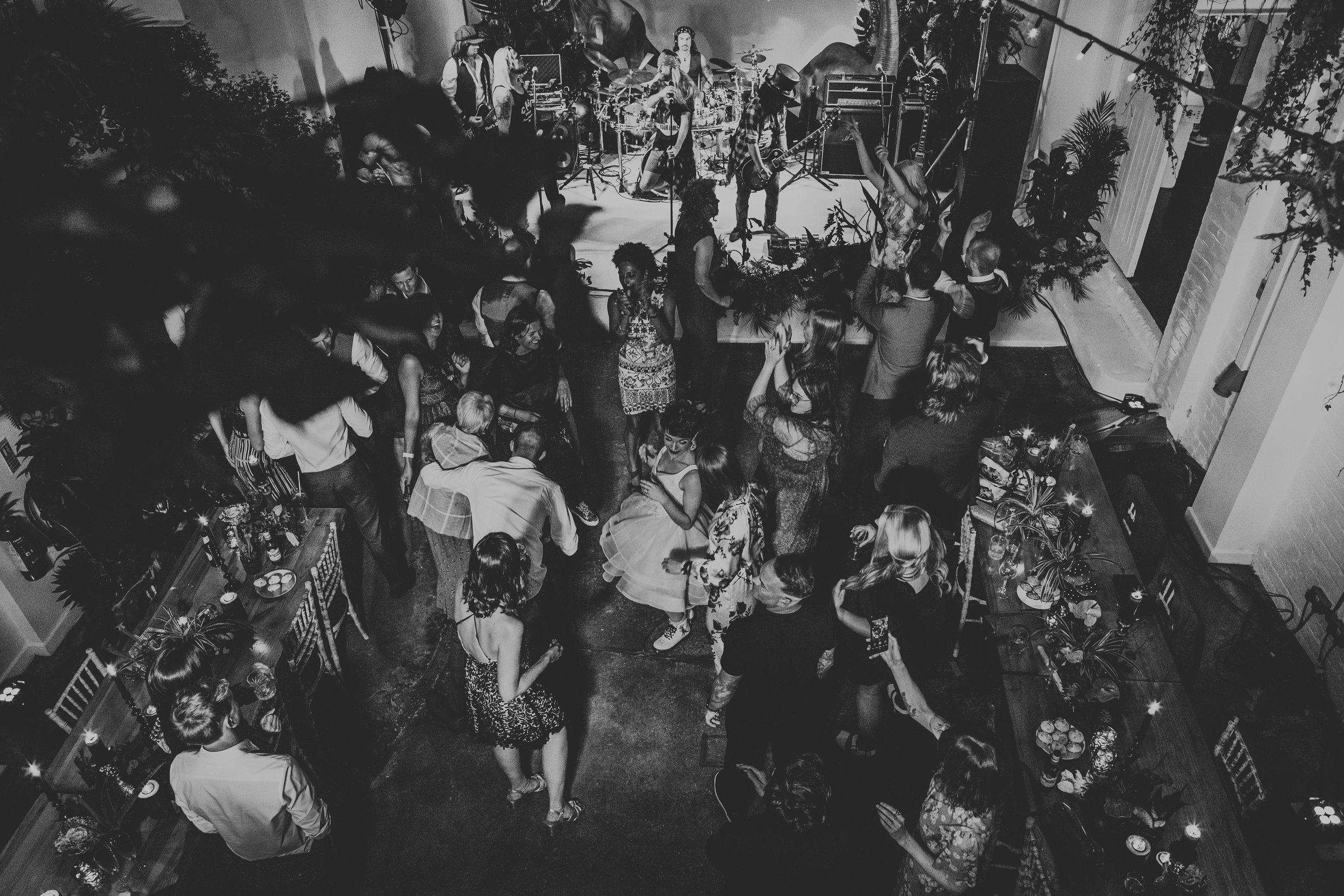 Ariel shot of everyone dancing on the dance floor in black and white. 