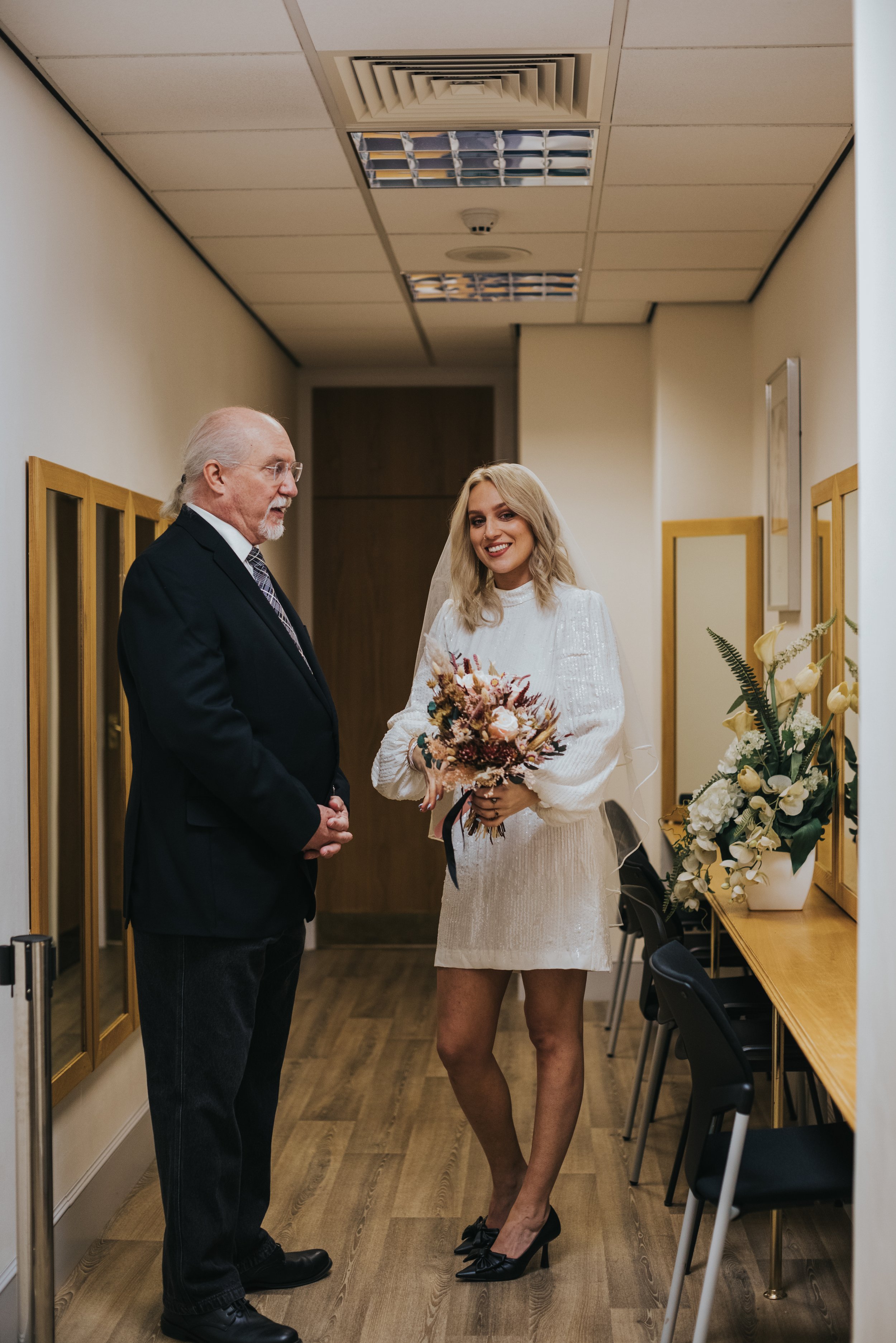 Bride and her father wait in side room on Heron House