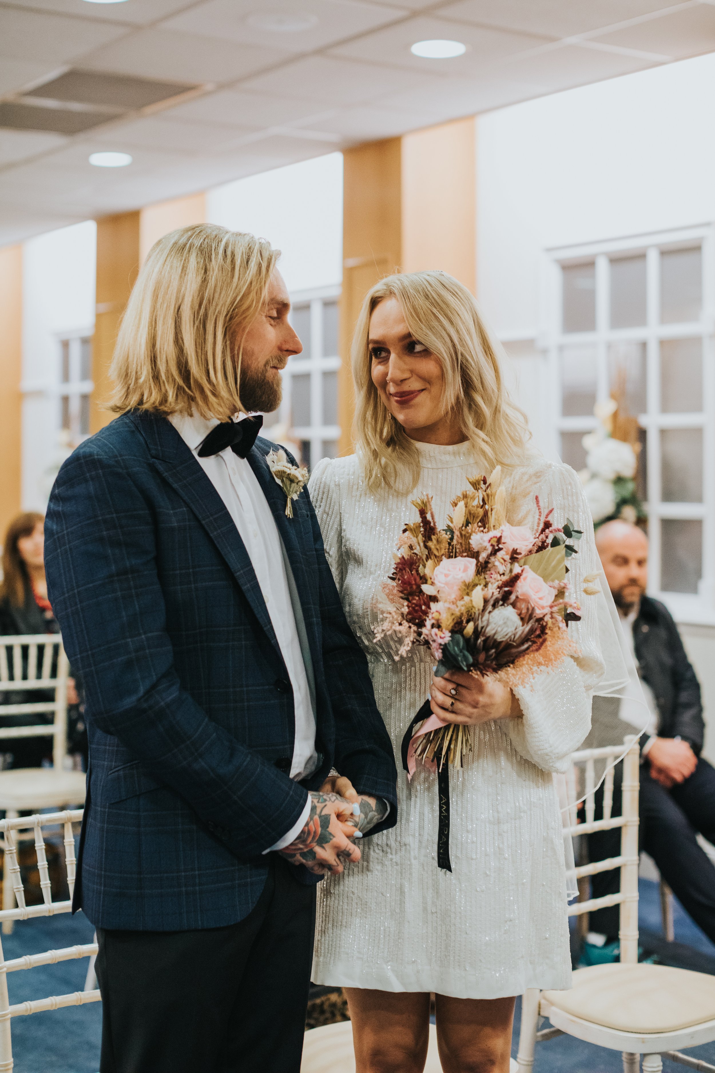 Bride and Groom take each other in for a moment. 