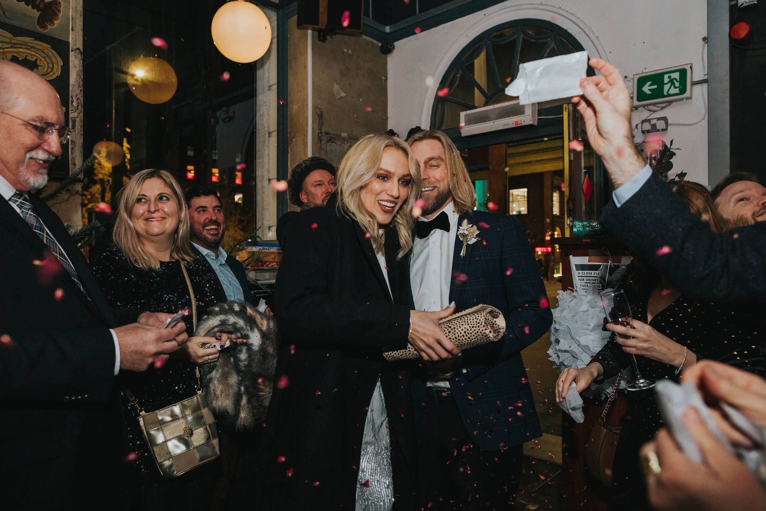 Bride and Groom enter Flok Manchester to a confetti welcome from their guests.