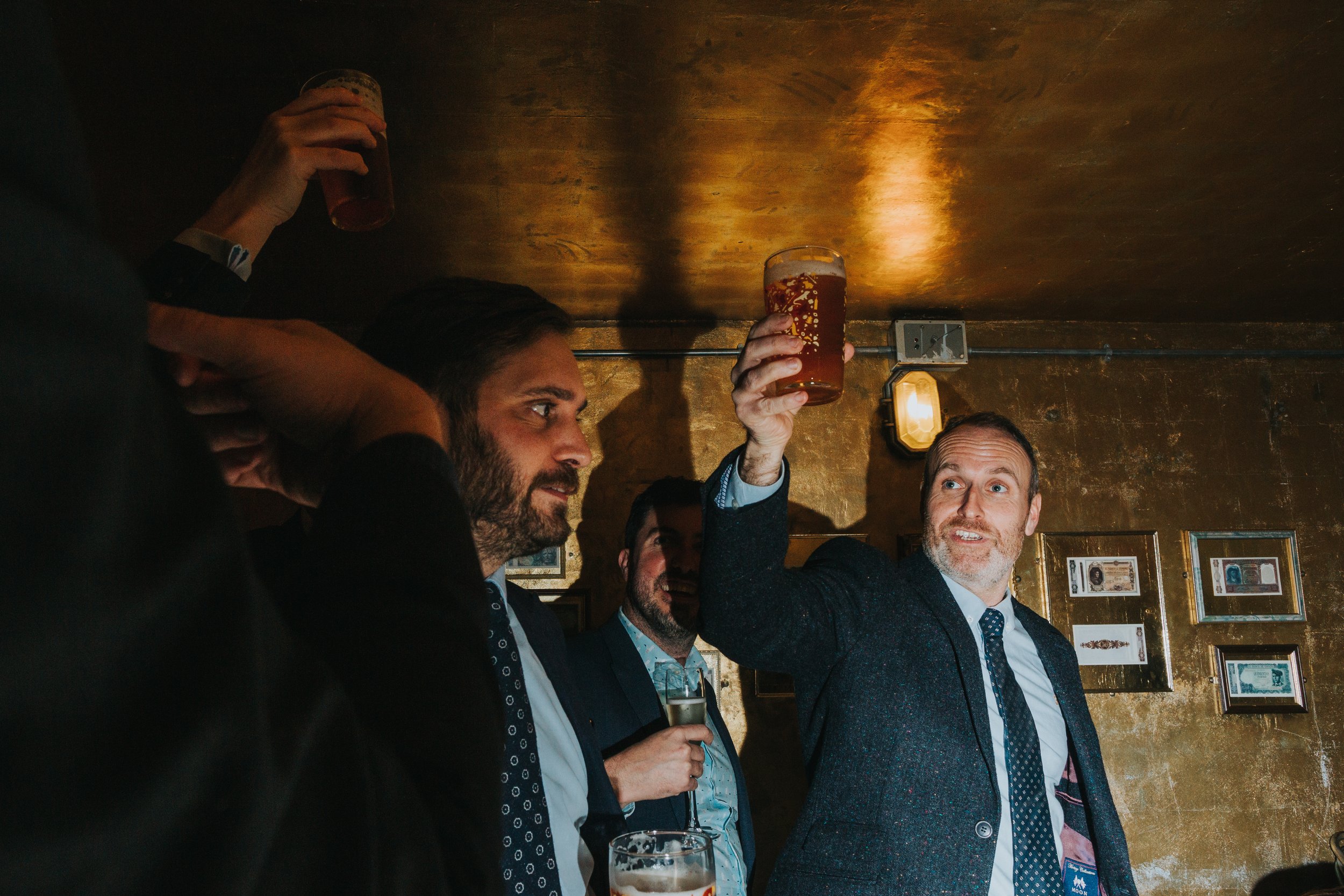 Wedding guests raise their glasses